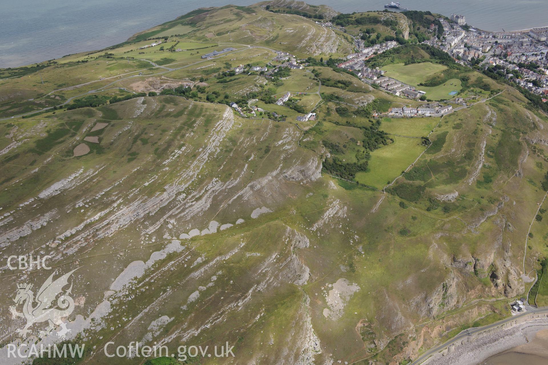 Llandudno pier and bar, Grand Hotel, tollgate house, Pen-y-Dinas Hillfort, Great Orme copper mine and tramway. Oblique aerial photograph taken during the Royal Commission's programme of archaeological aerial reconnaissance by Toby Driver on 30th July 2015.
