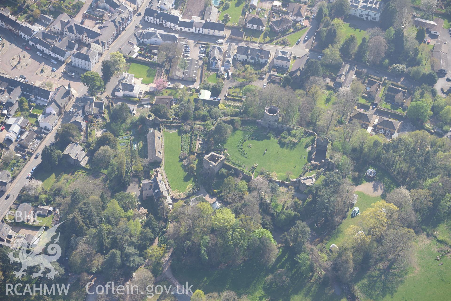 Usk Town including Usk Castle, Barn and Garden, and Plas Newydd Garden. Oblique aerial photograph taken during the Royal Commission's programme of archaeological aerial reconnaissance by Toby Driver on 21st April 2015