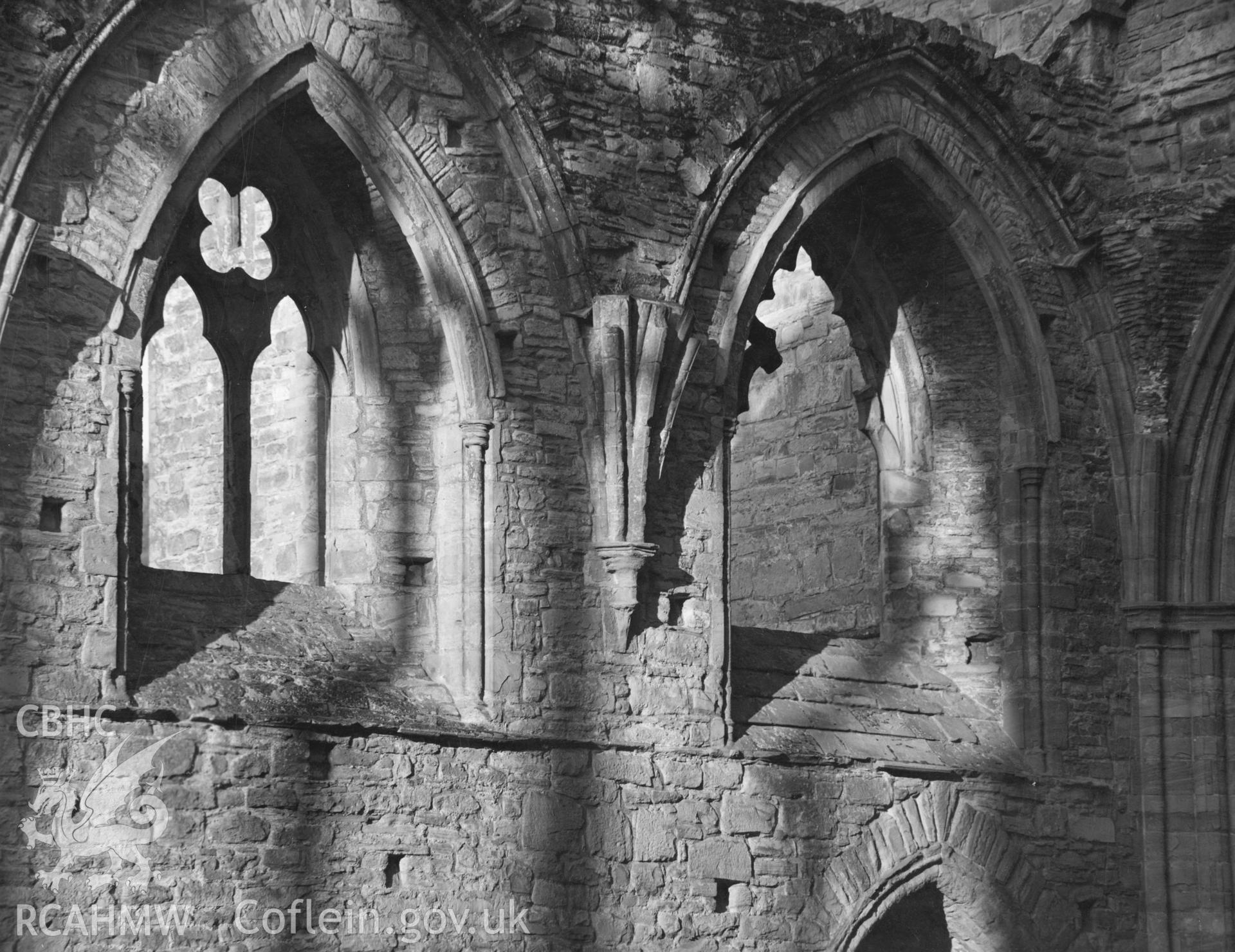 Digital copy of an interior view of Tintern Abbey showing east windows in the nave taken by Shirley Jones. dated 1943.