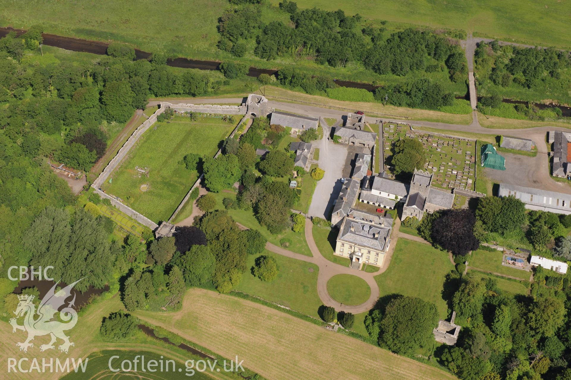 Ewenny Priory including views of the south and north gatehouses; Priory House; dovecote; north tower and St. Michael's church. Oblique aerial photograph taken during the Royal Commission's programme of archaeological aerial reconnaissance by Toby Driver on 19th June 2015.