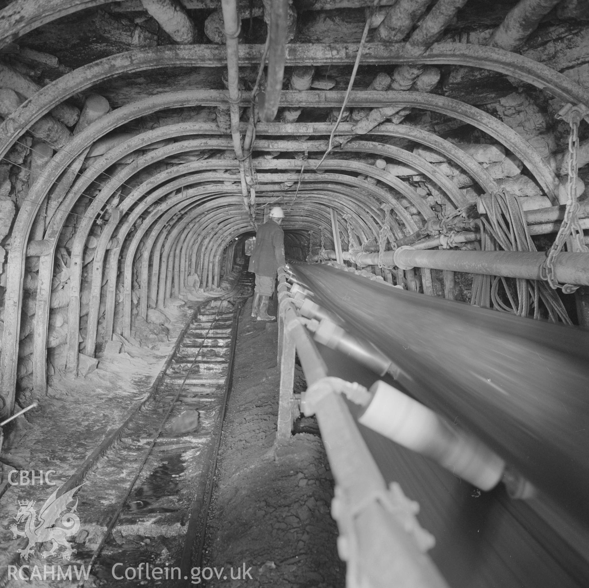 Digital copy of an acetate negative showing trunk road with conveyor belt carrying coal at Big Pit,from the John Cornwell Collection.