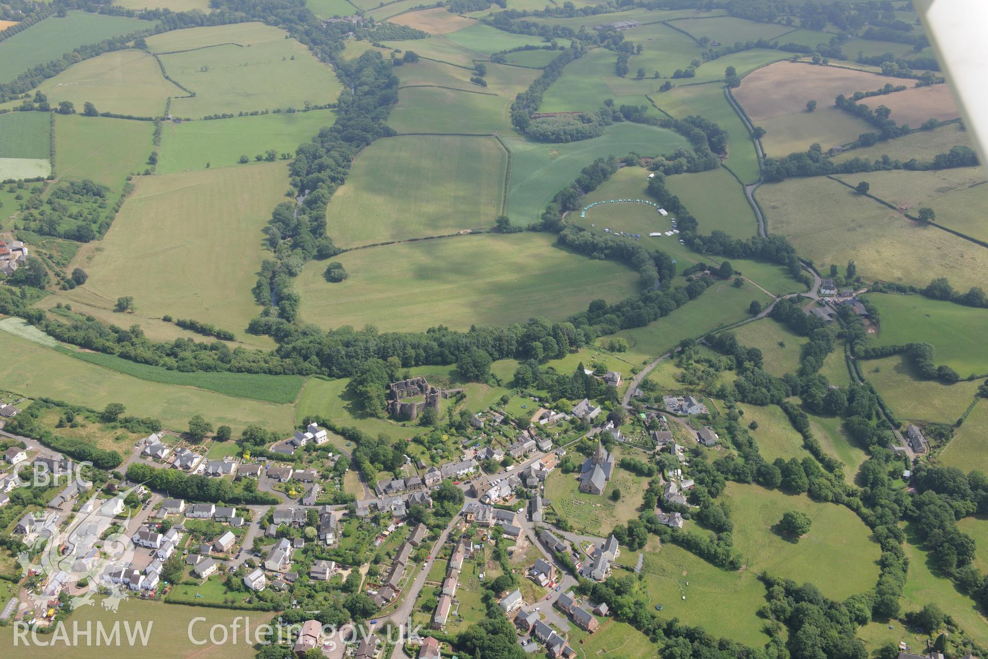 St. Nicholas' Church and Grosmont Castle, in the town of Grosmont, north east of Abergavenny. Oblique aerial photograph taken during the Royal Commission?s programme of archaeological aerial reconnaissance by Toby Driver on 1st August 2013.