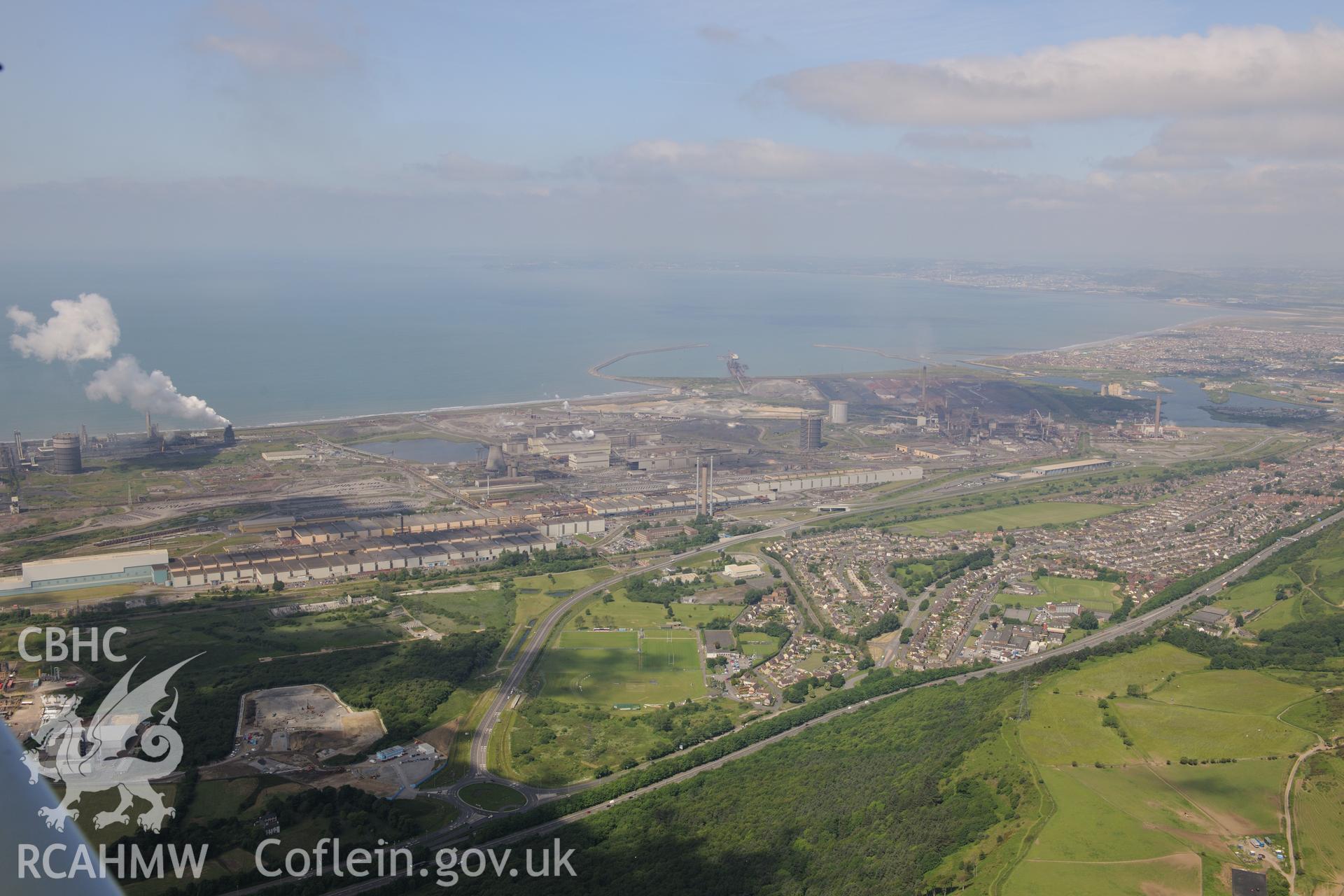 Margam suburb with the steelworks beyond, Porth Talbot. Oblique aerial photograph taken during the Royal Commission's programme of archaeological aerial reconnaissance by Toby Driver on 19th June 2015.