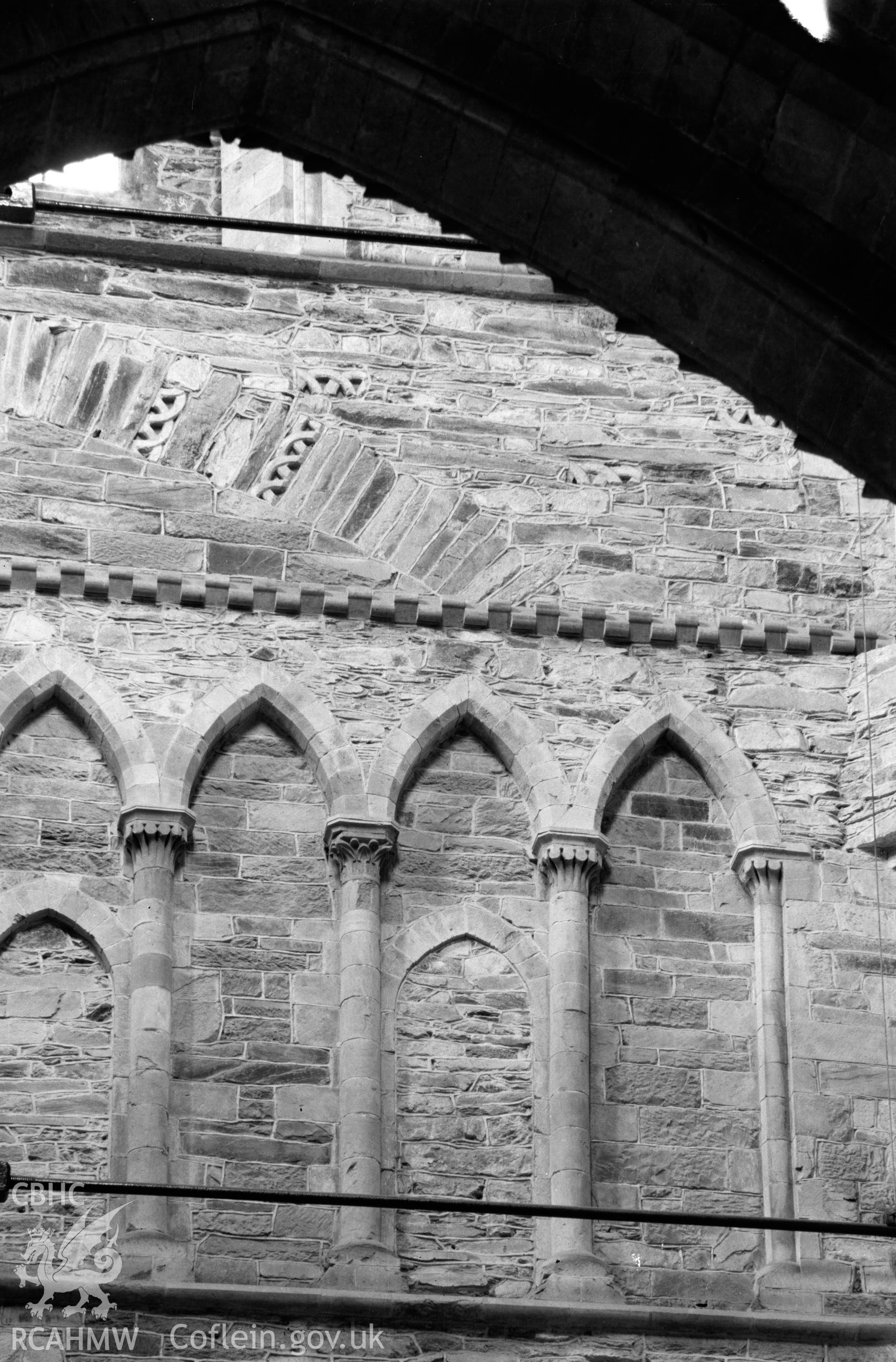 Digital copy of a black and white nitrate negative showing exterior view of engaged columns through arch at St. David's Cathedral, taken by E.W. Lovegrove, July 1936.