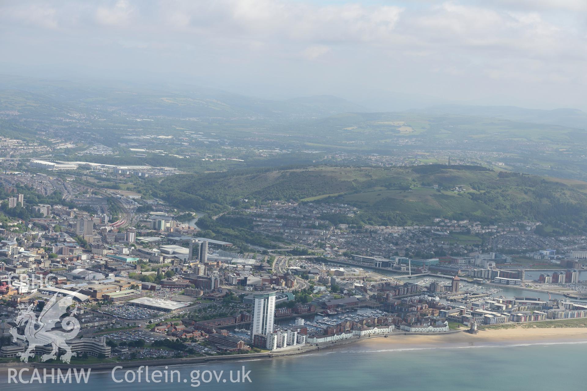 Views of south dock, Meridian Quay and the County Hall in the city of Swansea, taken from Swansea Bay. Oblique aerial photograph taken during the Royal Commission's programme of archaeological aerial reconnaissance by Toby Driver on 19th June 2015.