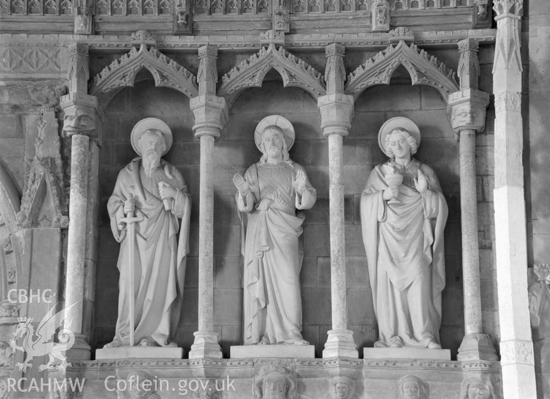 Digital copy of a black and white nitrate negative showing Saint's statues at St David's Cathedral, taken by E.W. Lovegrove, July 1936.