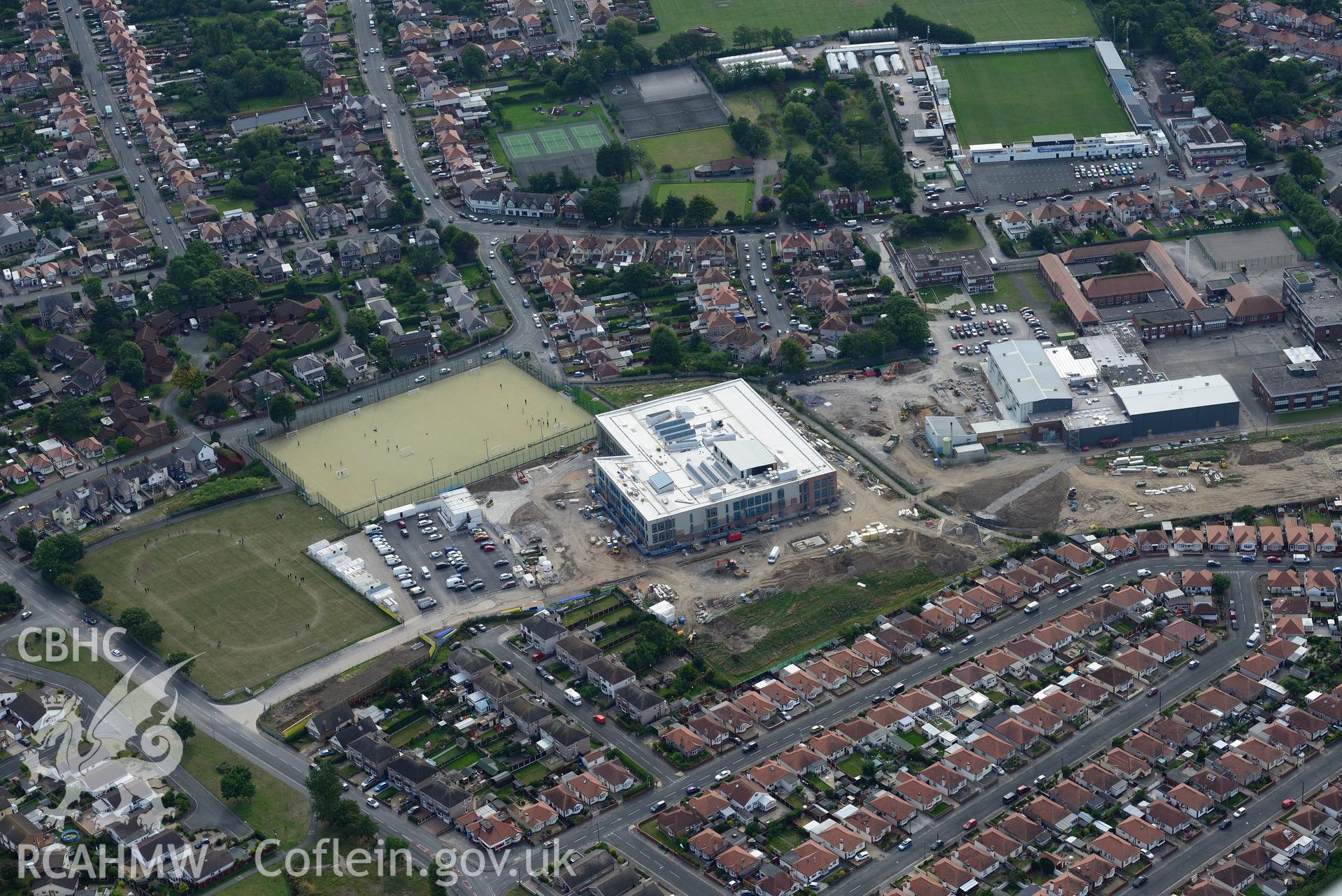 The old high school, the new high school (under construction) and the Botanical Gardens, Rhyl. Oblique aerial photograph taken during the Royal Commission's programme of archaeological aerial reconnaissance by Toby Driver on 11th September 2015.