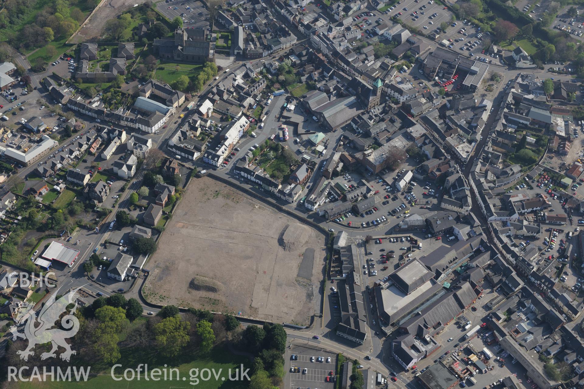 Abergavenny including Town and Market Hall; St Mary's Church and Priory House. Oblique aerial photograph taken during the Royal Commission's programme of archaeological aerial reconnaissance by Toby Driver on 21st April 2015.