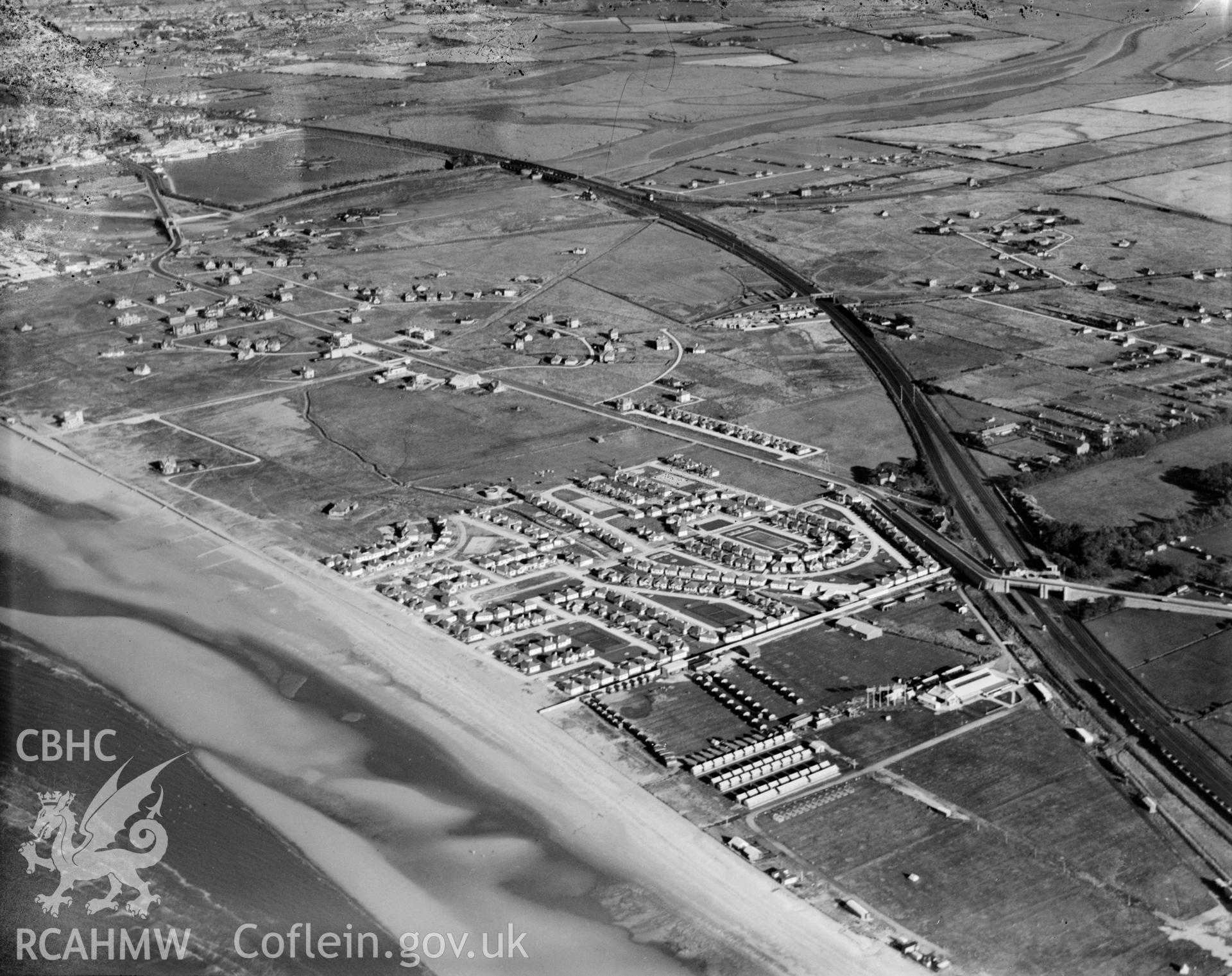View of the Kinmel Bay area of Rhyl showing holiday camp, oblique aerial view. 5?x4? black and white glass plate negative.