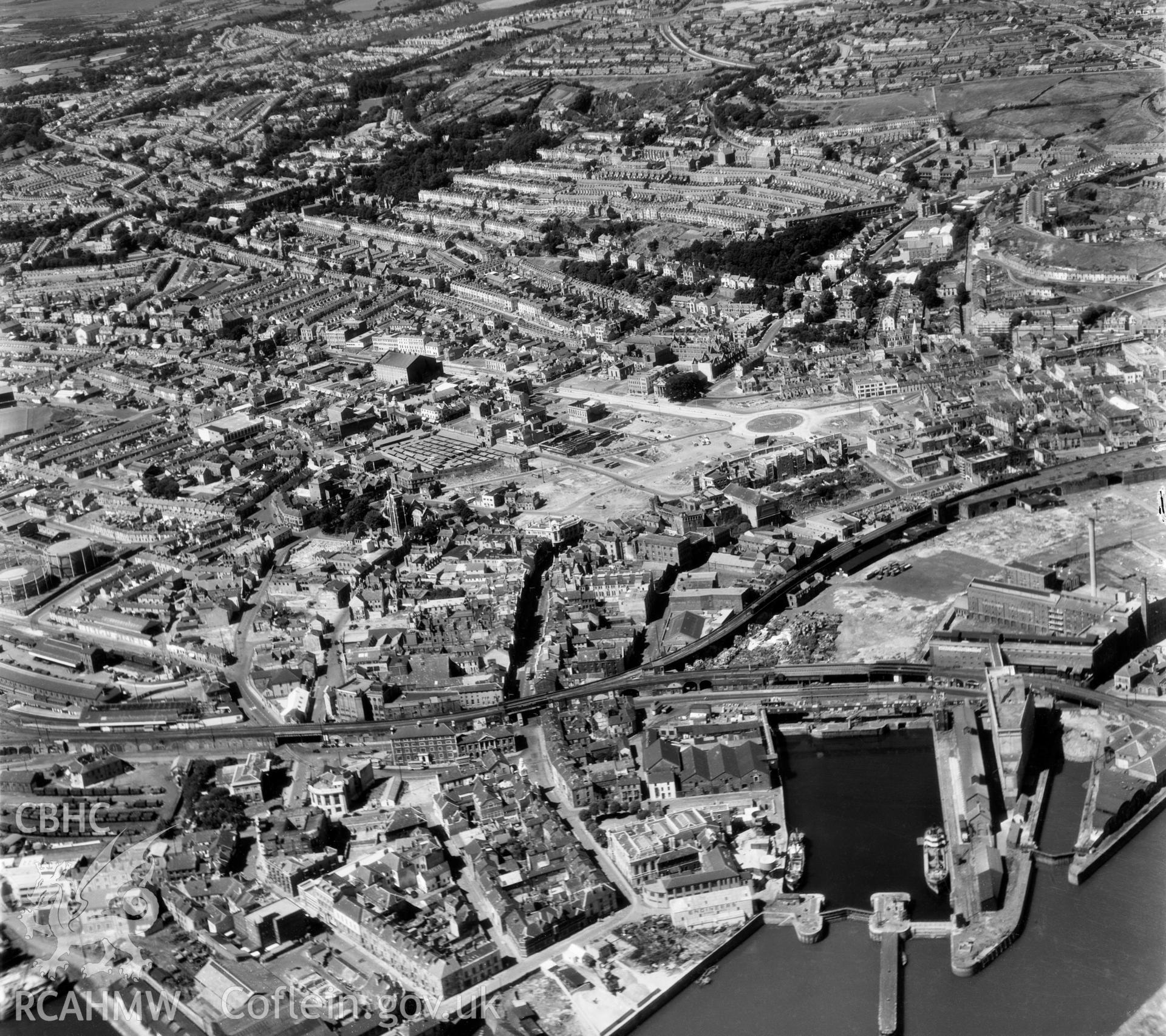 Black and white oblique aerial photograph showing Swansea town centre, from Aerofilms album no. W.30, taken by Aero Pictorial Ltd. and dated 7/8/1950.