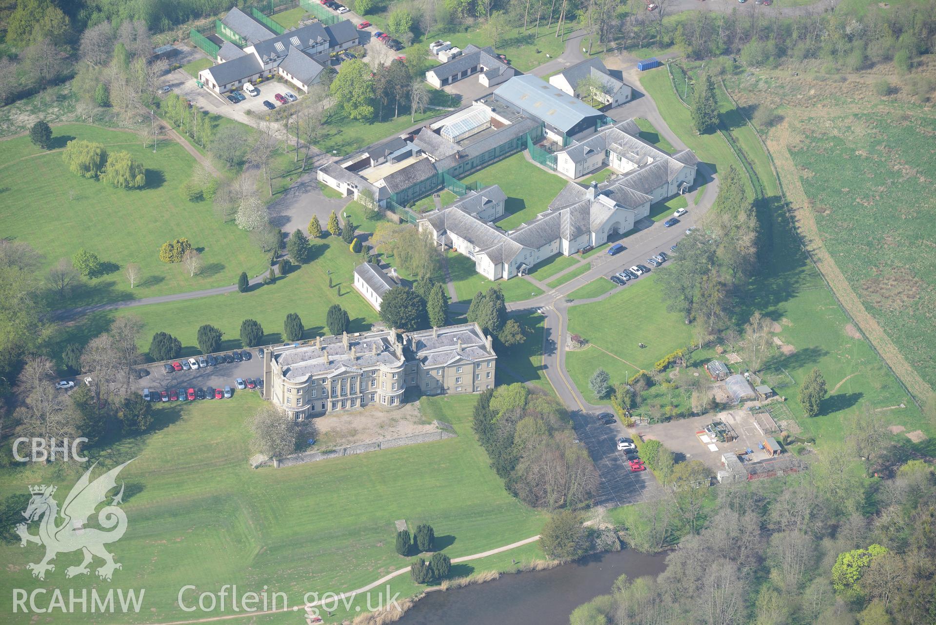 Llanarth Court Garden and Stableblock, and St Mary & St Michael Church. Oblique aerial photograph taken during the Royal Commission's programme of archaeological aerial reconnaissance by Toby Driver on 21st April 2015