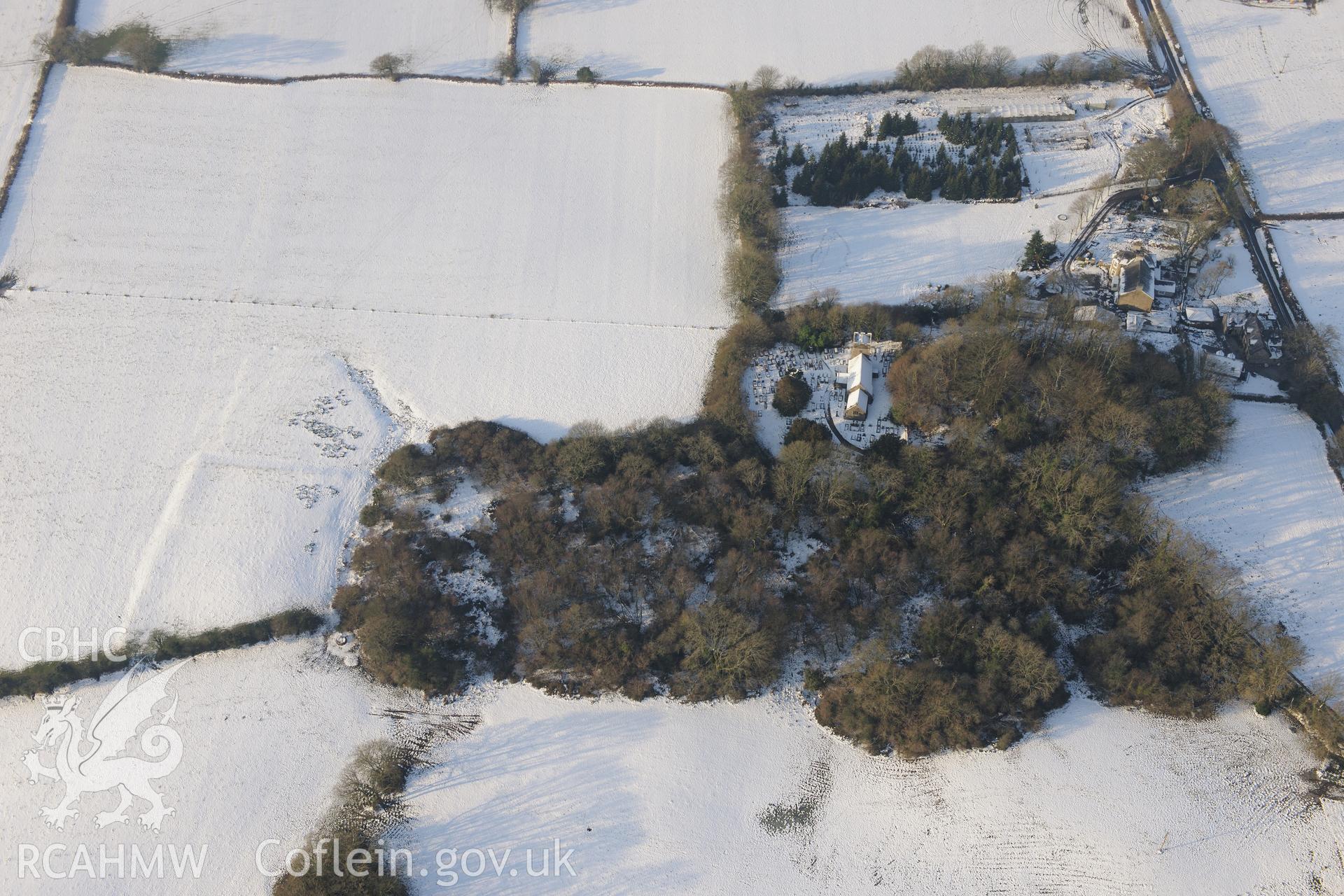 St. Illtyd's Church, Llanilid Castle ring-work and Gadlys moated site, Llanharan, east of Bridgend. Oblique aerial photograph taken during the Royal Commission?s programme of archaeological aerial reconnaissance by Toby Driver on 24th January 2013.