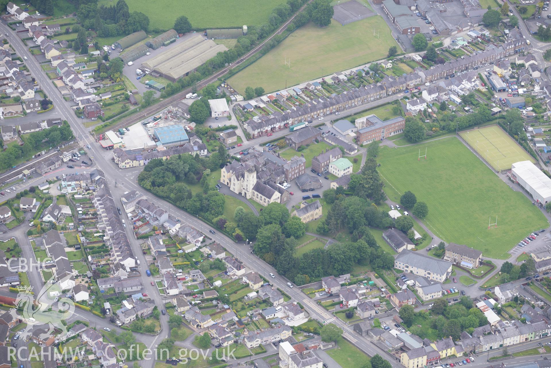 Llandovery college; railway station; Buffer Depot and Llandovery town. Oblique aerial photograph taken during the Royal Commission's programme of archaeological aerial reconnaissance by Toby Driver on 11th June 2015.