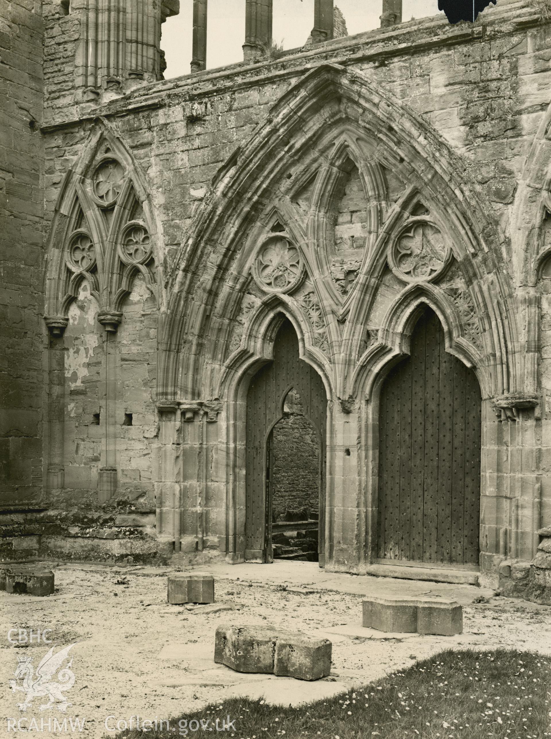 Digital copy of an early National Buildings Record photograph showing the great west doorway at Tintern Abbey.