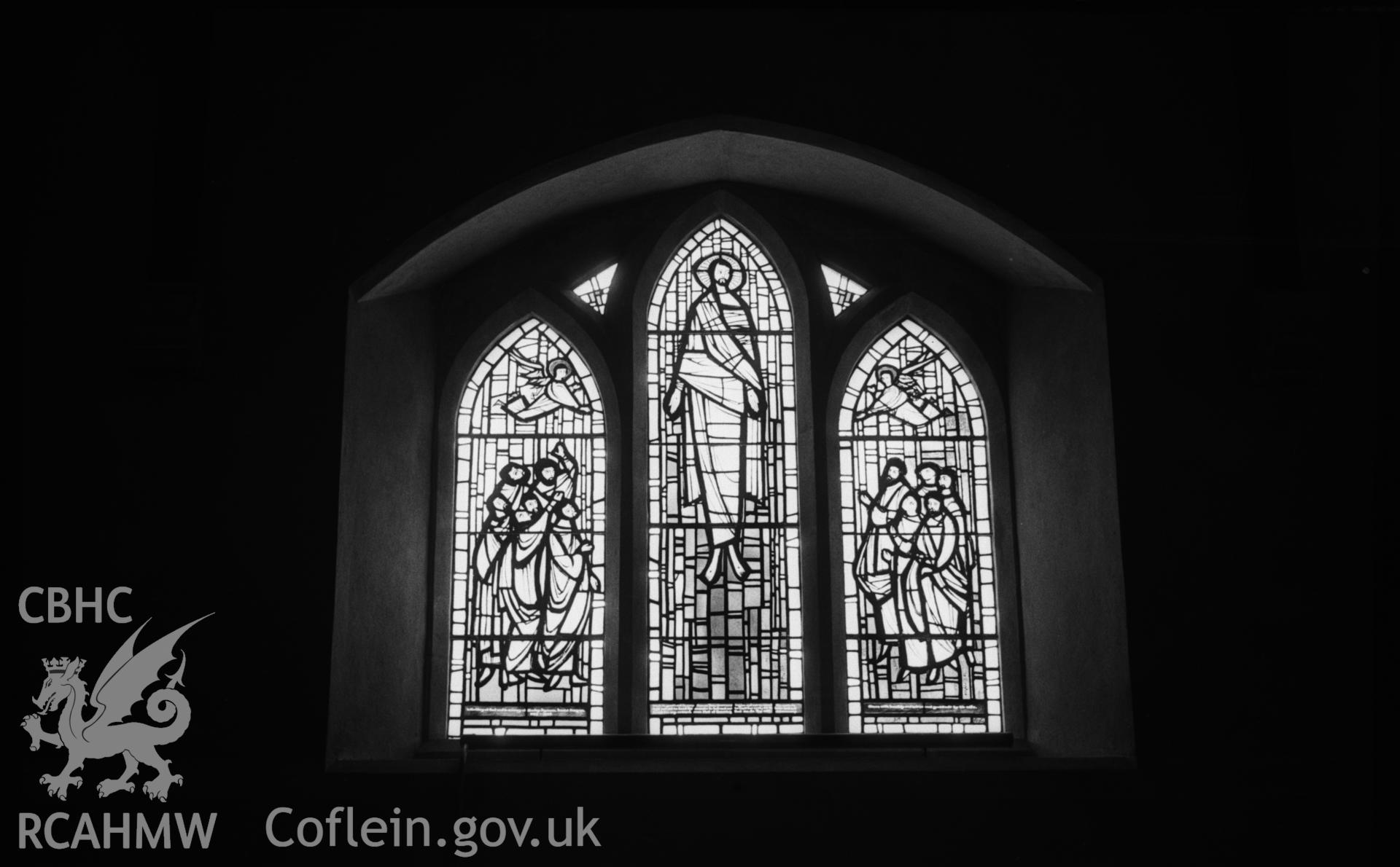 Digital copy of a black and white negative showing stained glass window to Stanley Johnson by Roy Lewis, 1962, in south wall of nave at St. Michael's church, Llandre. Photographed in April 1963 by Arthur O. Chater.