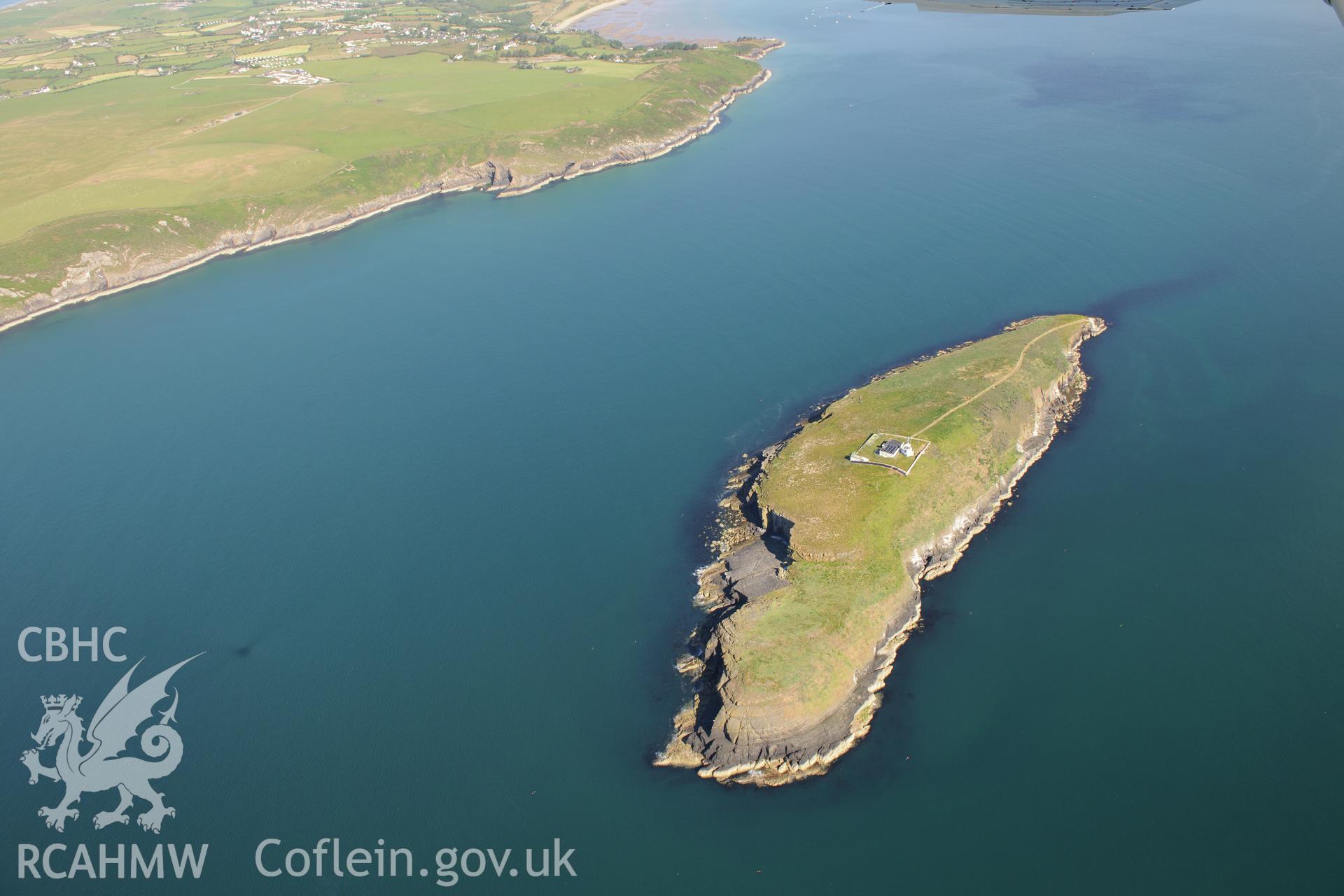 St Tudwal's Island West, its lighthouse and St Tudwal's Sound. Oblique aerial photograph taken during the Royal Commission's programme of archaeological aerial reconnaissance by Toby Driver on 23rd June 2015.