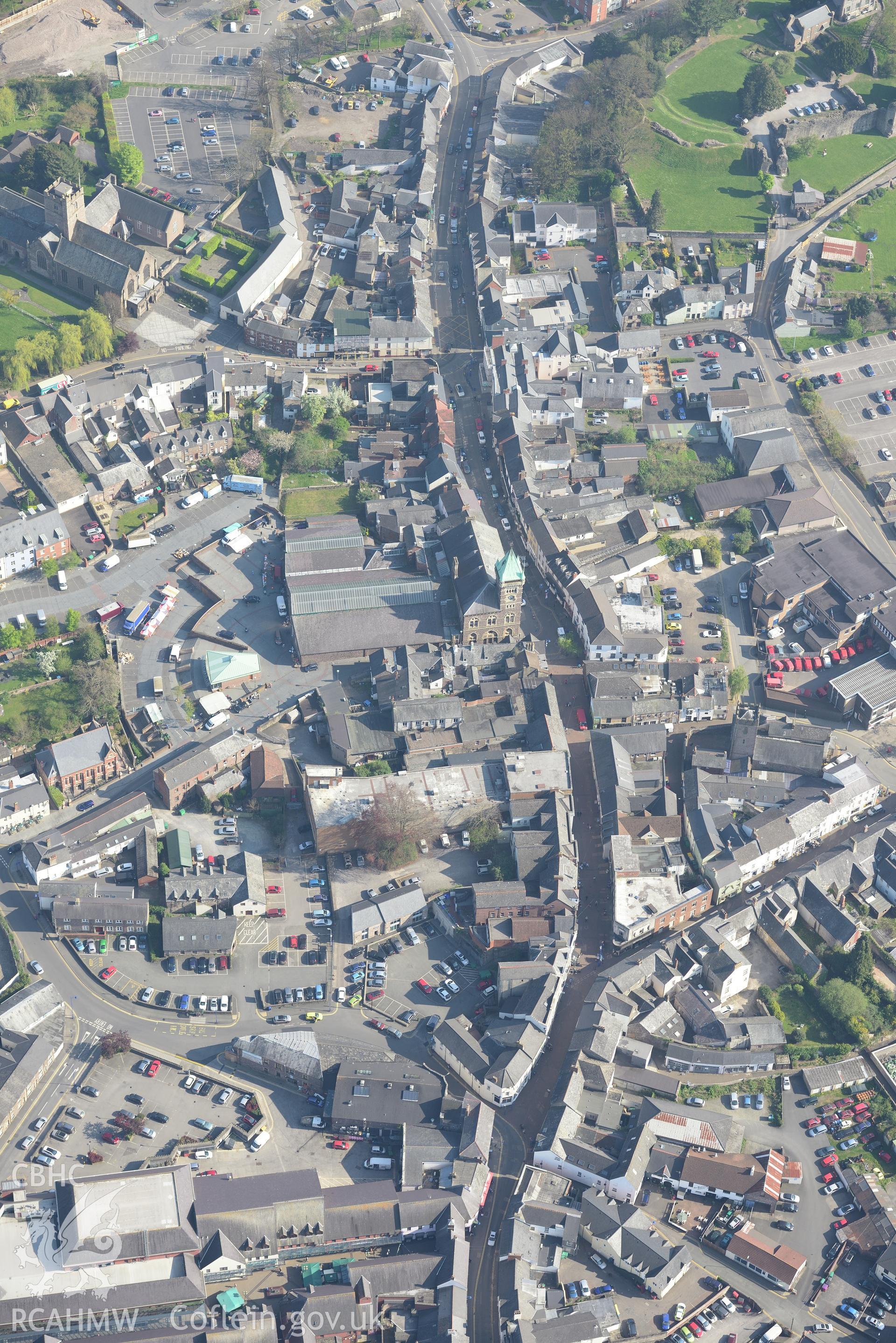 Abergavenny including the Castle, Castle Garden and Museum; Town and Market Halls; St. Mary's Church; Priory House and the Brewery Yard. Oblique aerial photograph taken during the Royal Commission's programme of archaeological aerial reconnaissance by Toby Driver on 21st April 2015.