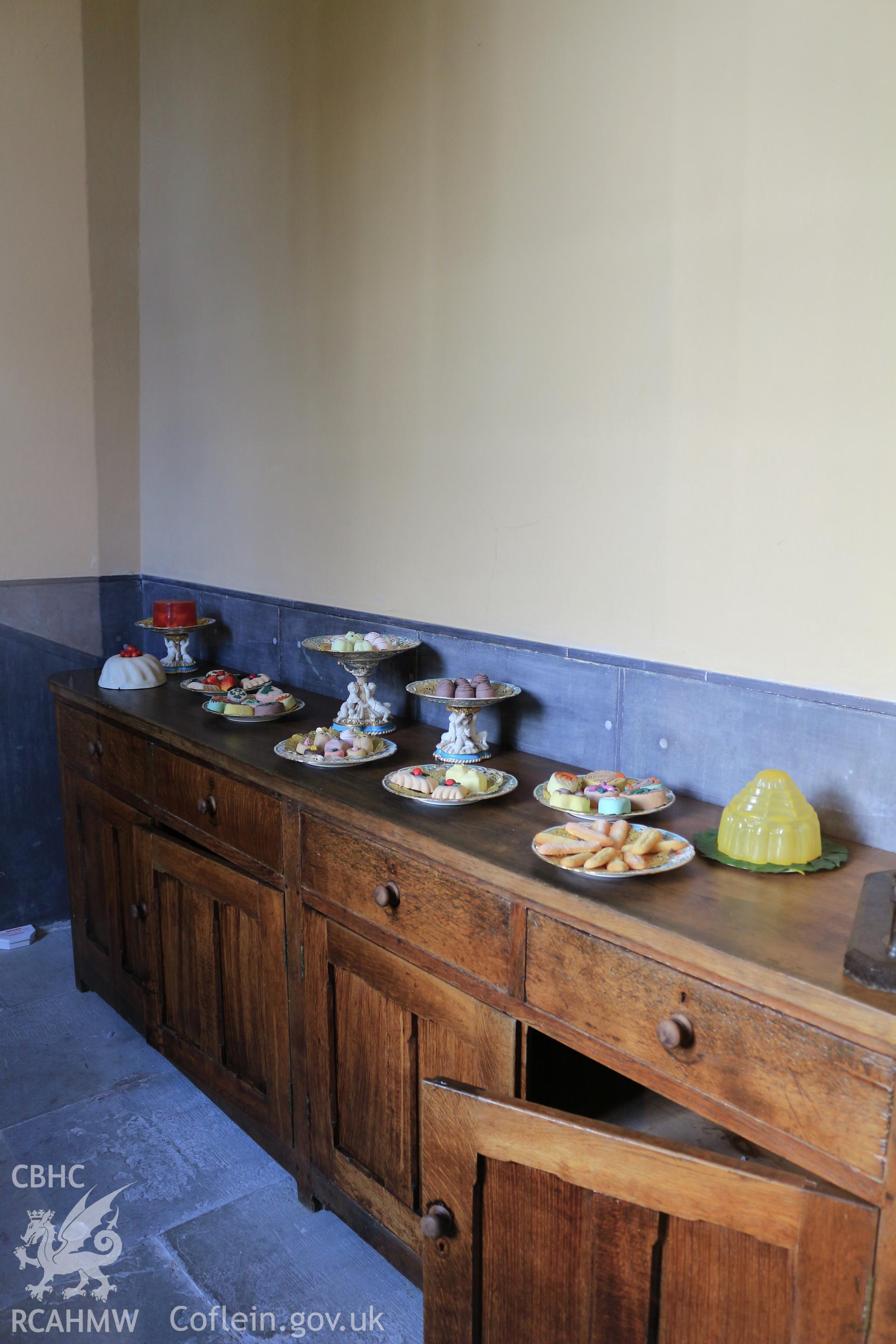 Photographic survey of Penrhyn Castle, Bangor. Kitchens, display of wax model desserts.