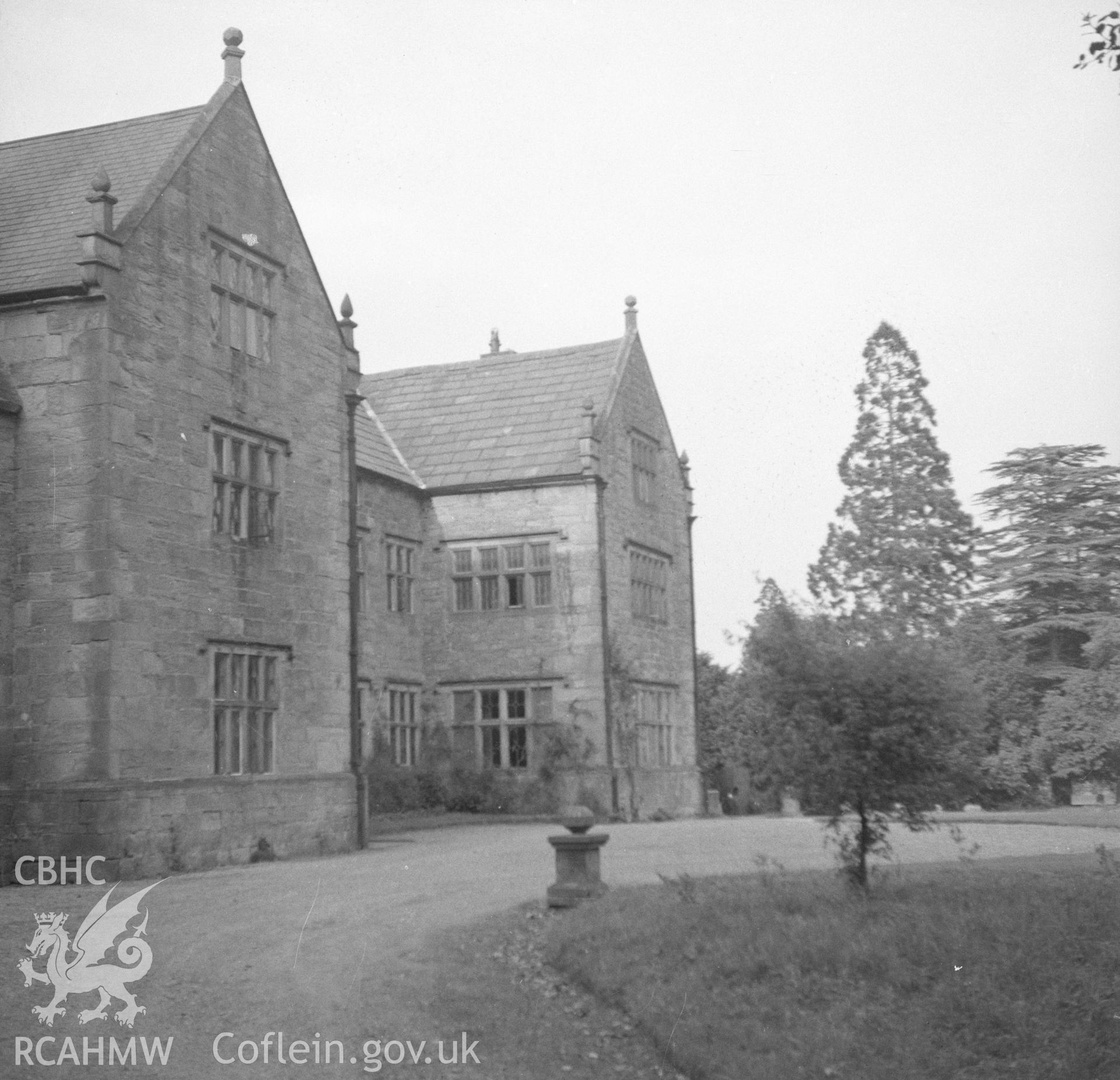 Digital copy of a black and white nitrate negative showing exterior, oblique view of front elevation of Pentrehobyn Hall.