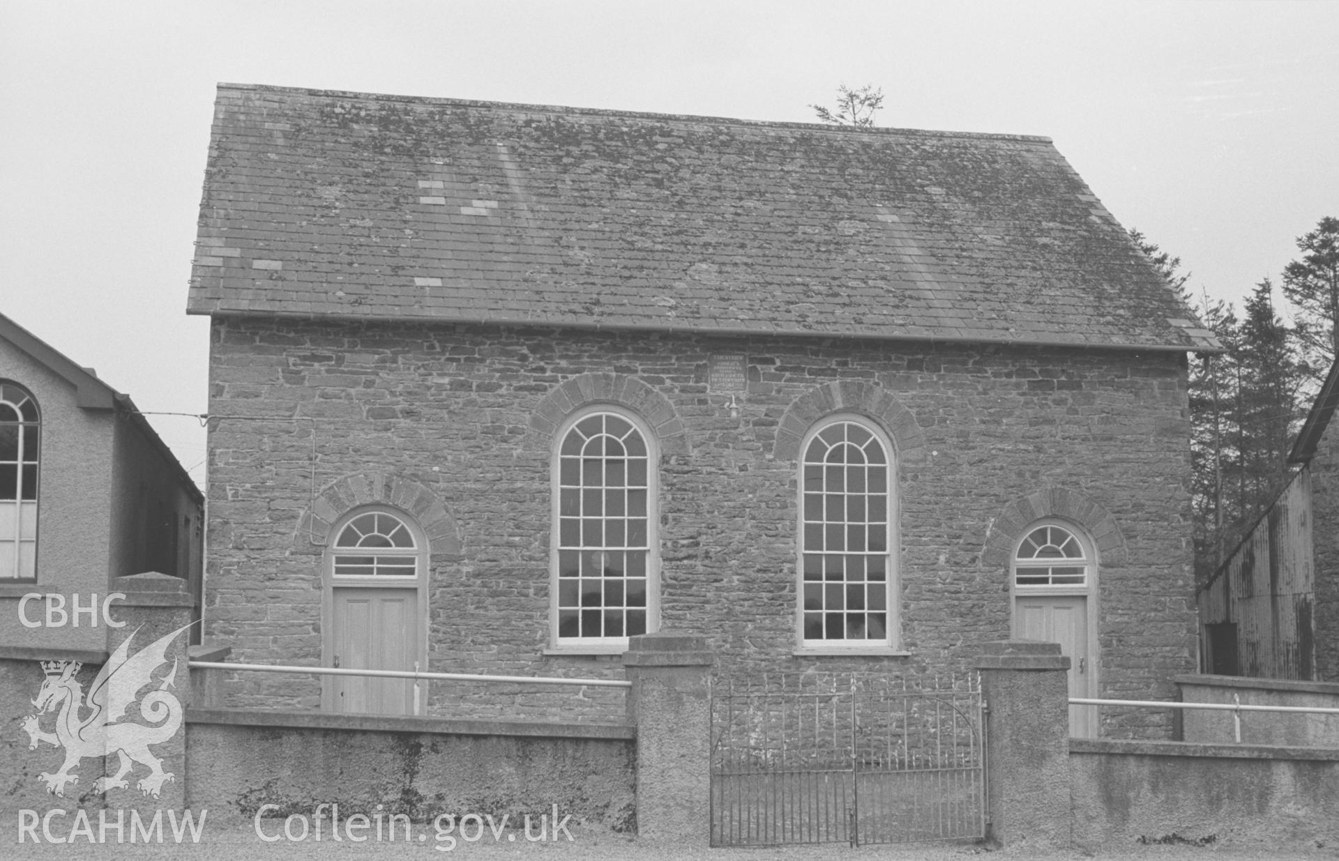 Digital copy of black & white negative of Troed-y-Rhiw Welsh Independent Chapel, Cribyn. Inscription: 'TROEDYRHIW ADDOLDY'R ANNIBYNWYR YR HWN A ADEILADWYD YN Y FLWYDDYN 1861' Photograph by Arthur Chater, April 1964 from SN50015219, looking west south west.