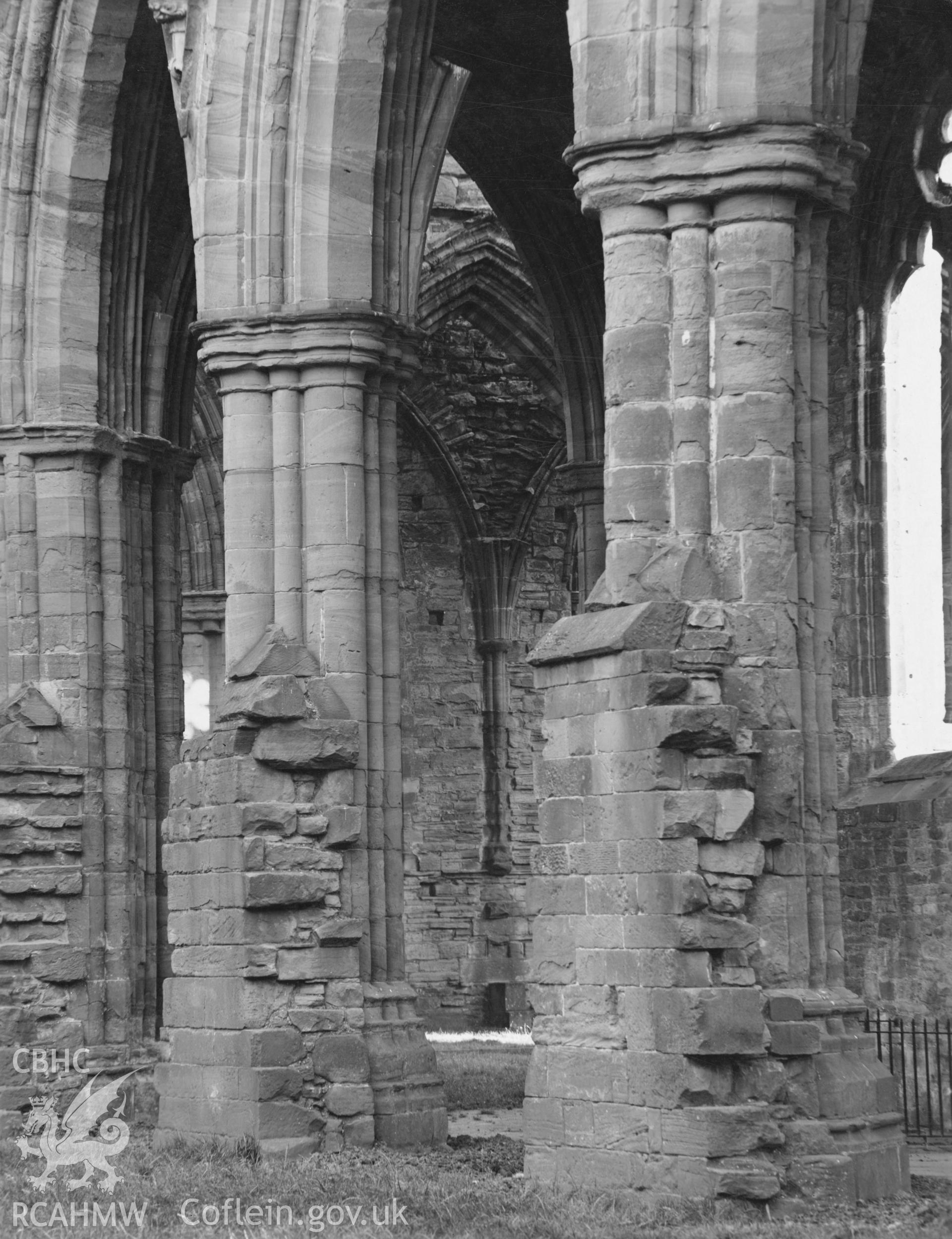 Digital copy of a photograph showing piers in the south of the nave and southwest tower at Tintern Abbey taken by Shirley Jones, dated 1943.