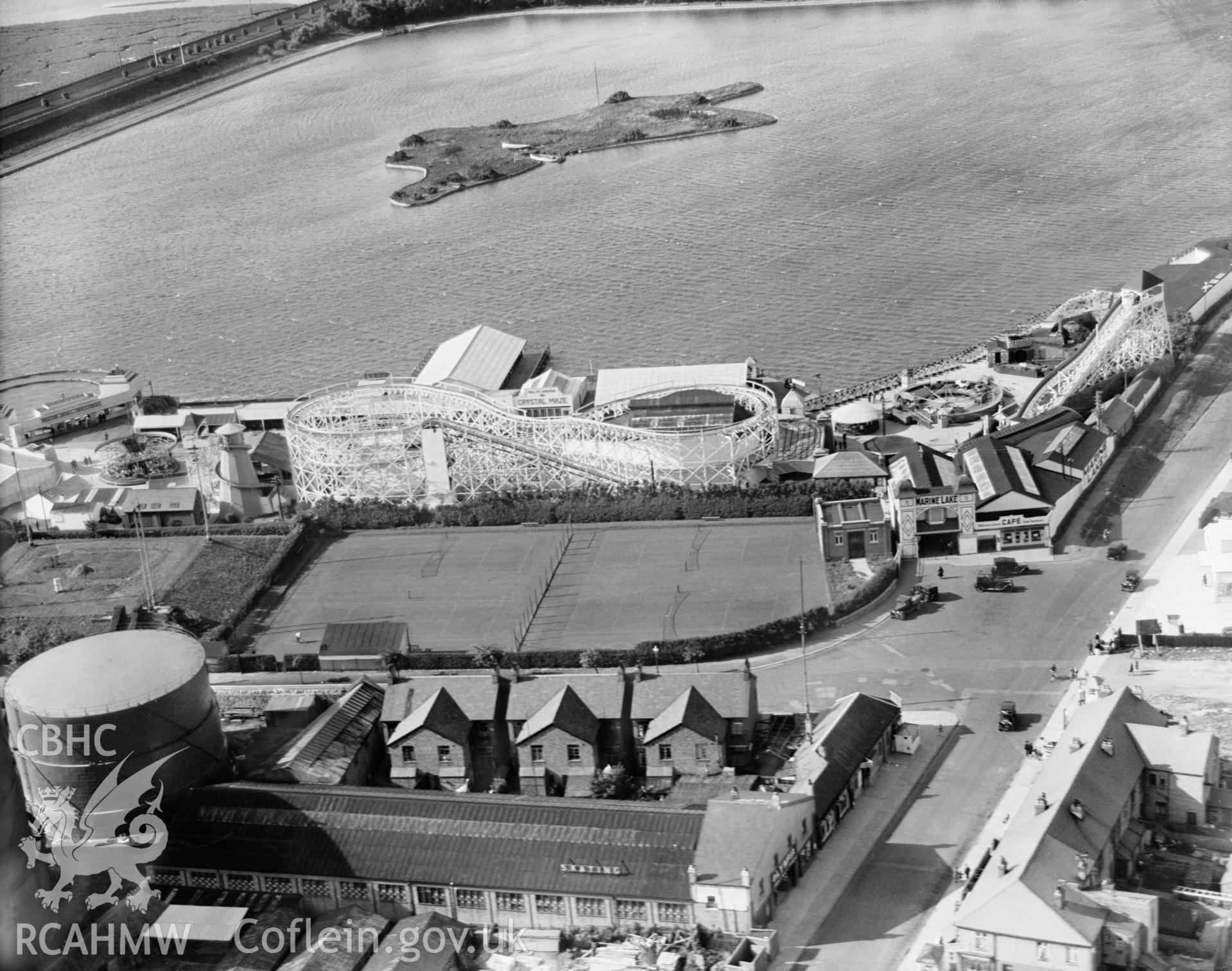 View of Rhyl showing the Marine Lake and funfair, oblique aerial view. 5?x4? black and white glass plate negative.