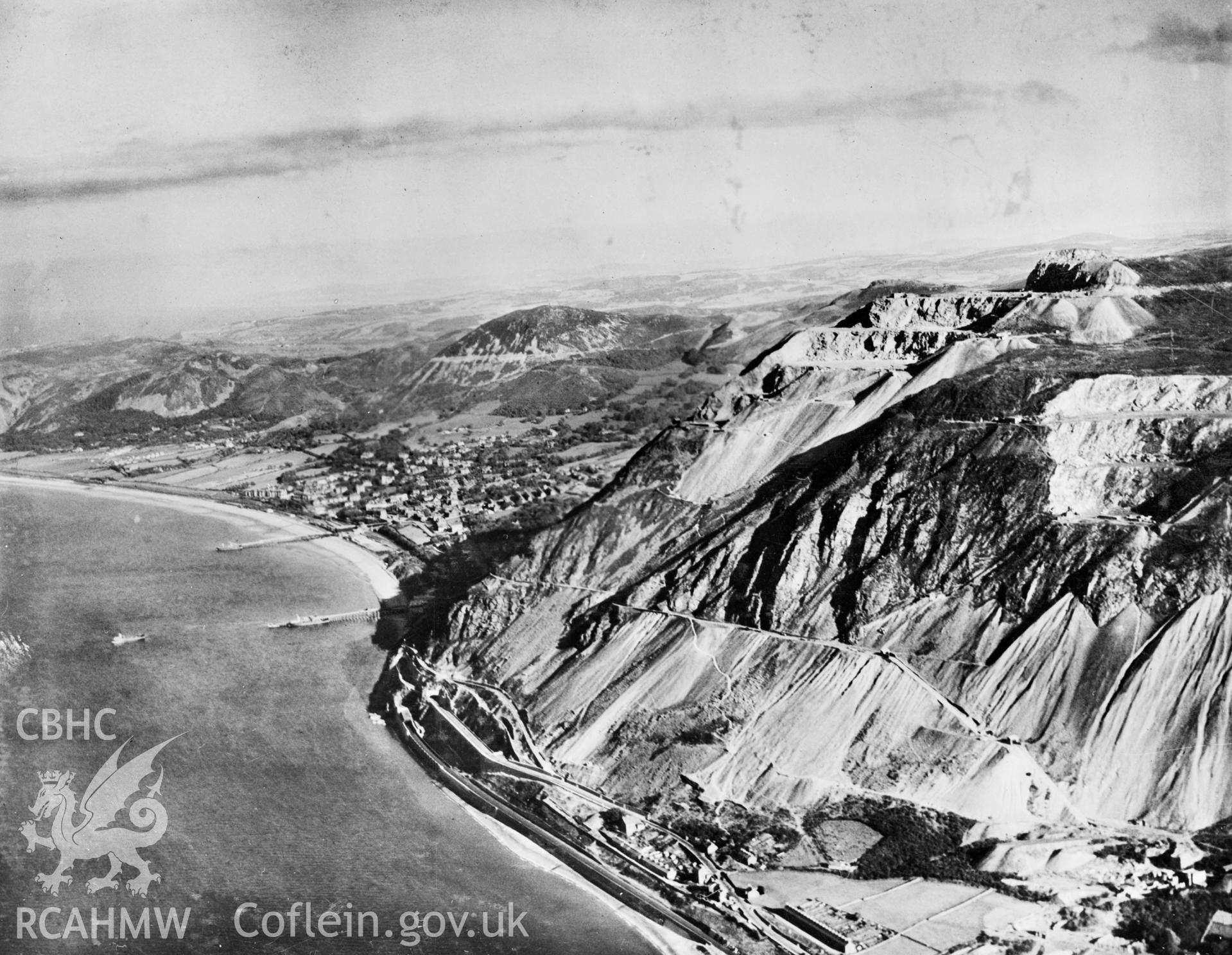 View of the newly completed Pen-y-clip road tunnels at Penmaenmawr showing Llanfairfechan. Oblique aerial photograph, 5?x4? BW glass plate.
