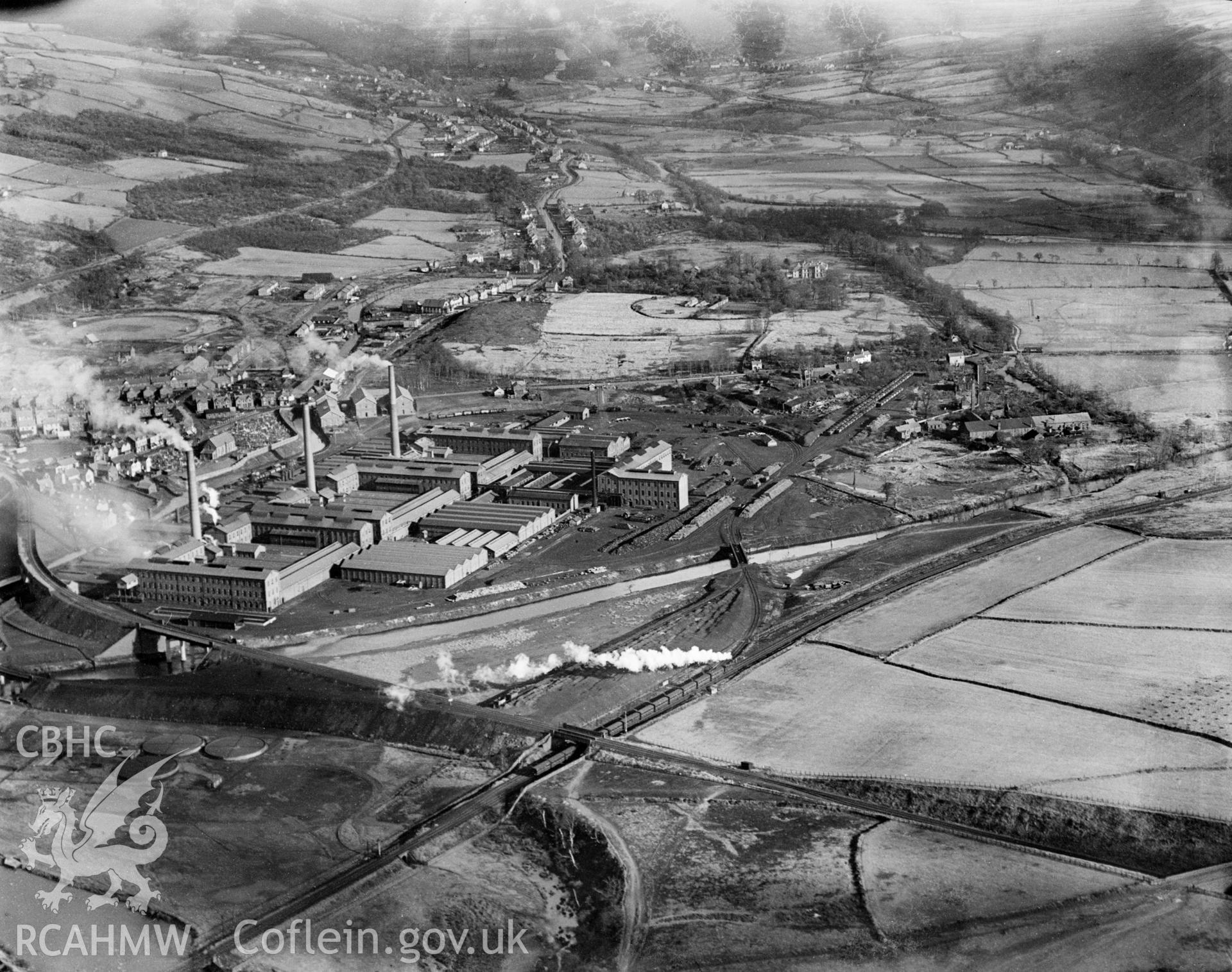 View of the Mond Nickel Company, Clydach looking Northeast up the Tawe Valley towards Trebanos. Clydach town centre is to the left. Oblique aerial view. 5?x4? black and white glass plate negative.