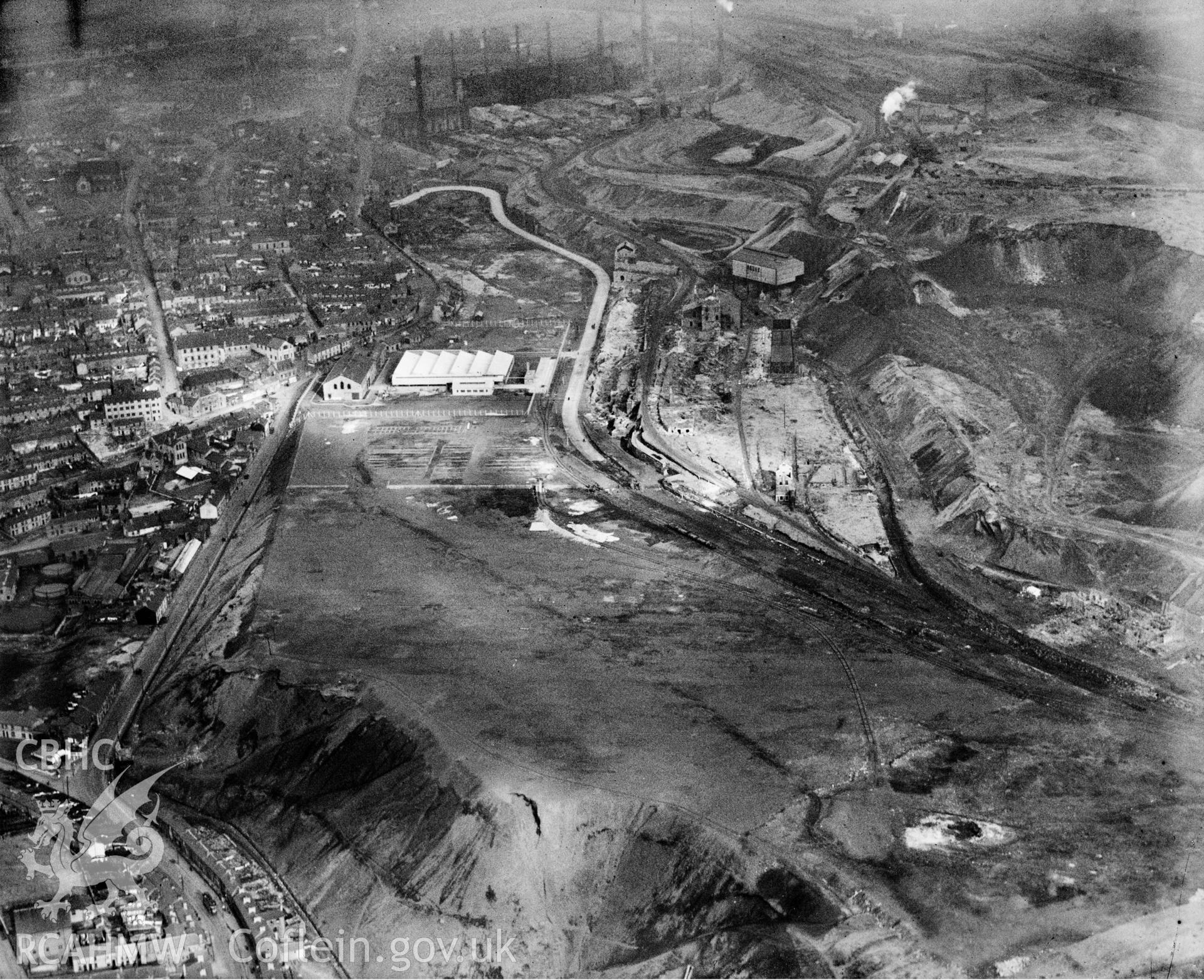 View of Dowlais Ironworks showing Dowlais great tip, oblique aerial view. 5?x4? black and white glass plate negative.