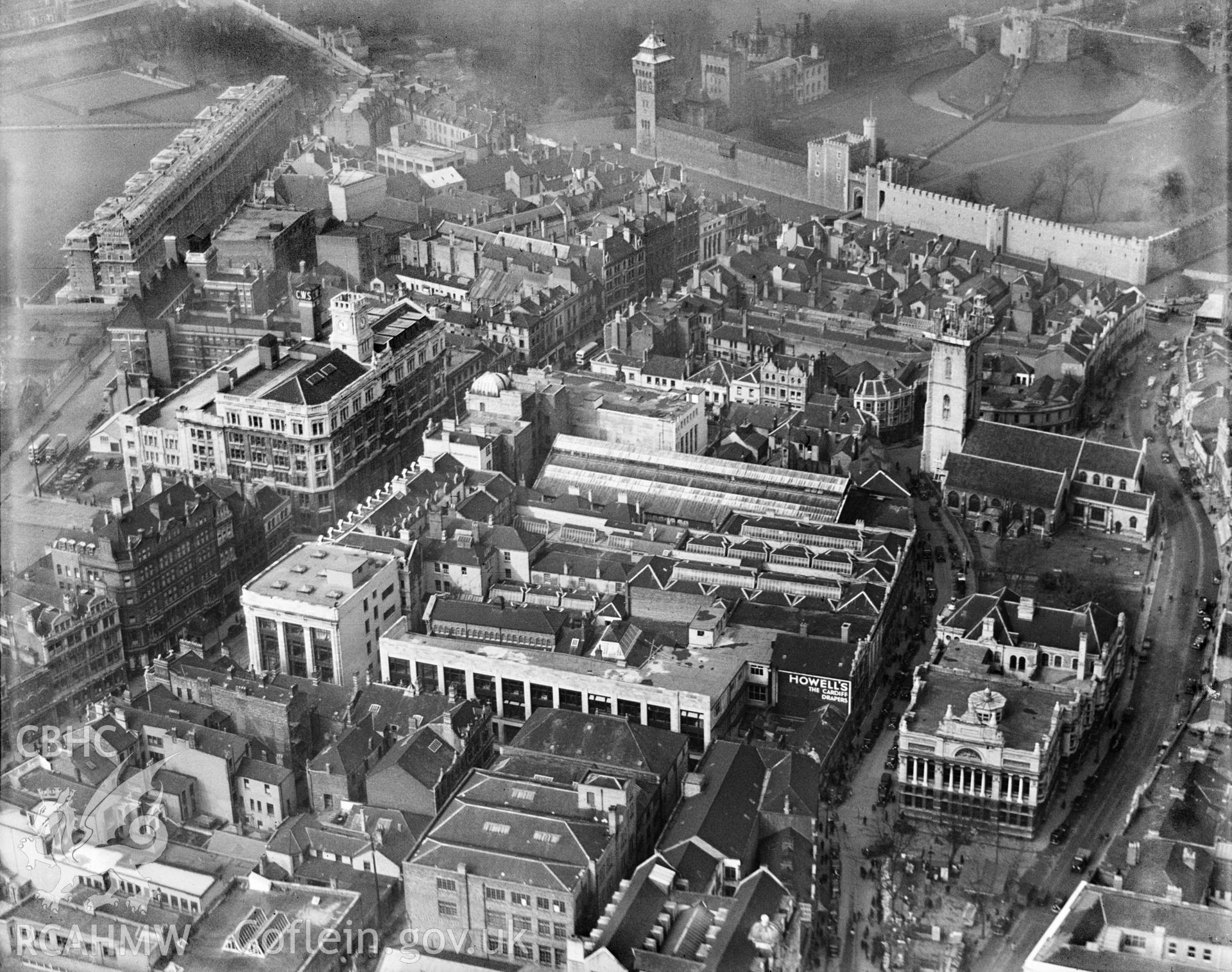 View of central Cardiff, showing James Howell & Co. Ltd. and central library, oblique aerial view. 5?x4? black and white glass plate negative.
