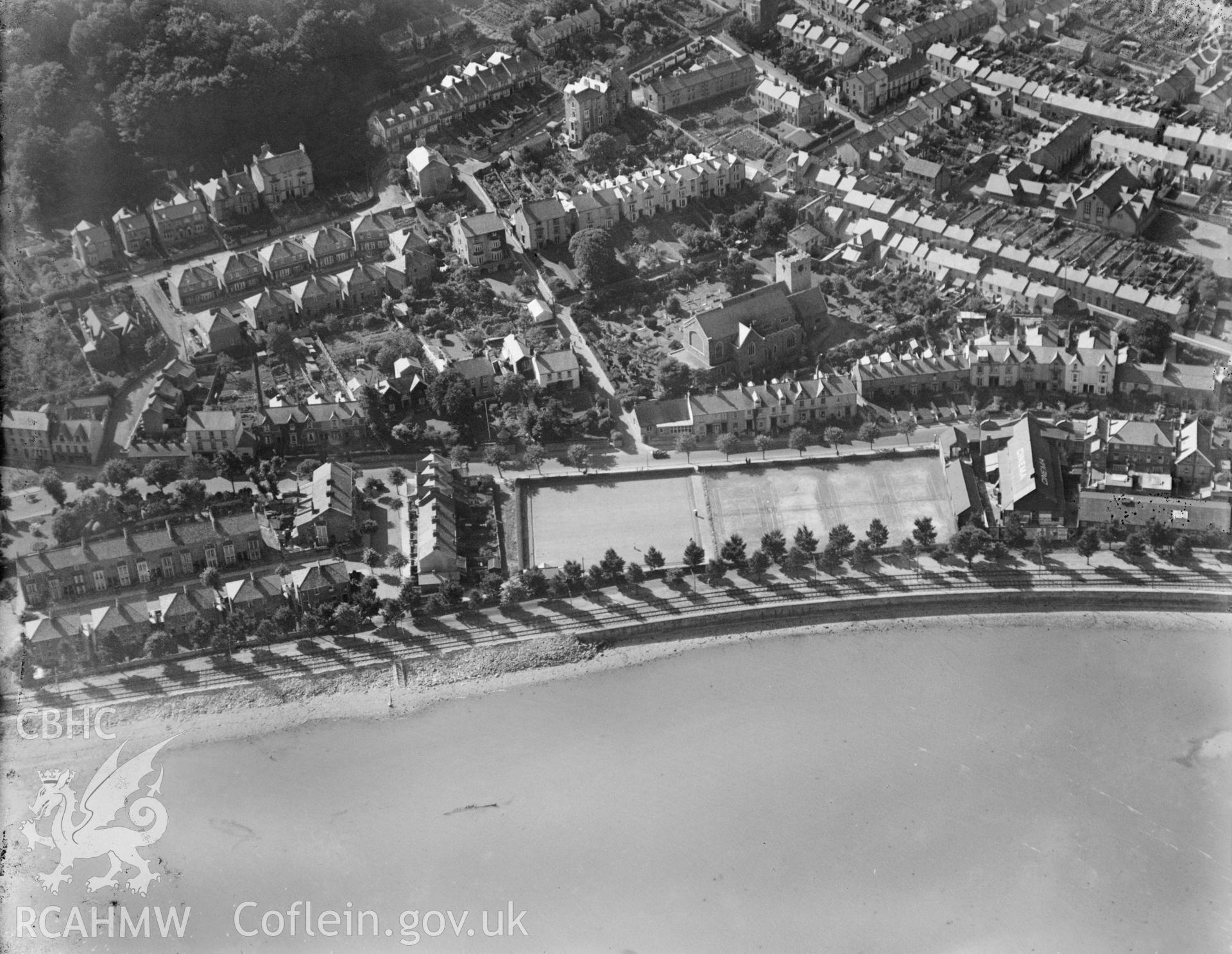 View of Mumbles showing railway, tennis courts and cinema, oblique aerial view. 5?x4? black and white glass plate negative.