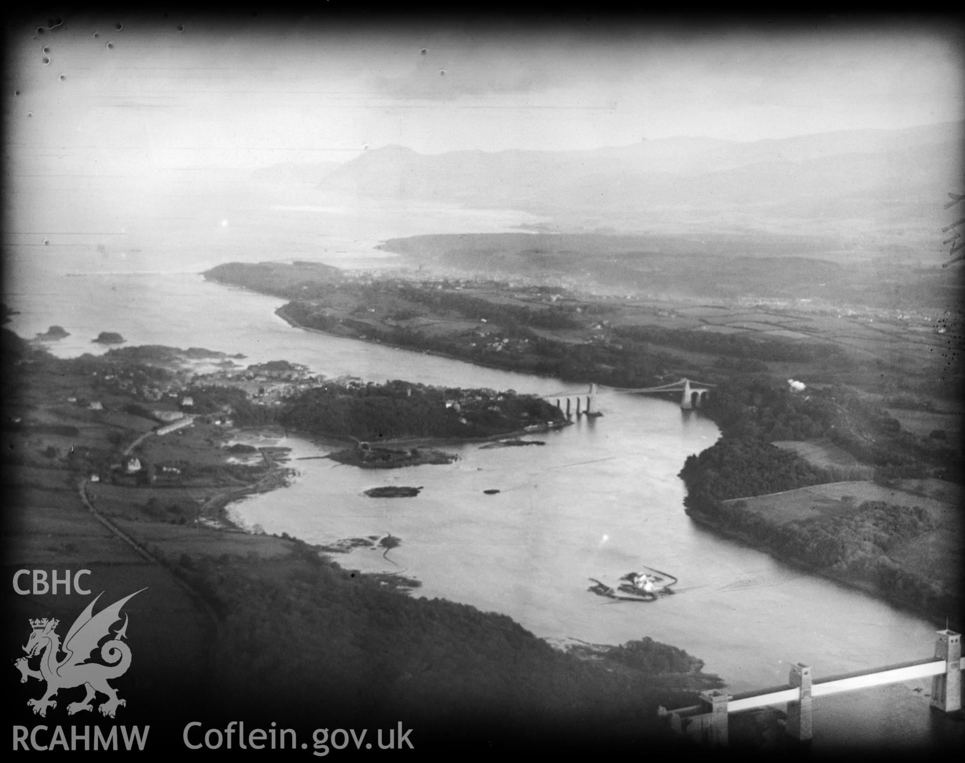 View of the Menai Straits showing Menai Supension Bridge and the Britannia Bridge. Oblique aerial photograph, 5?x4? BW glass plate.
