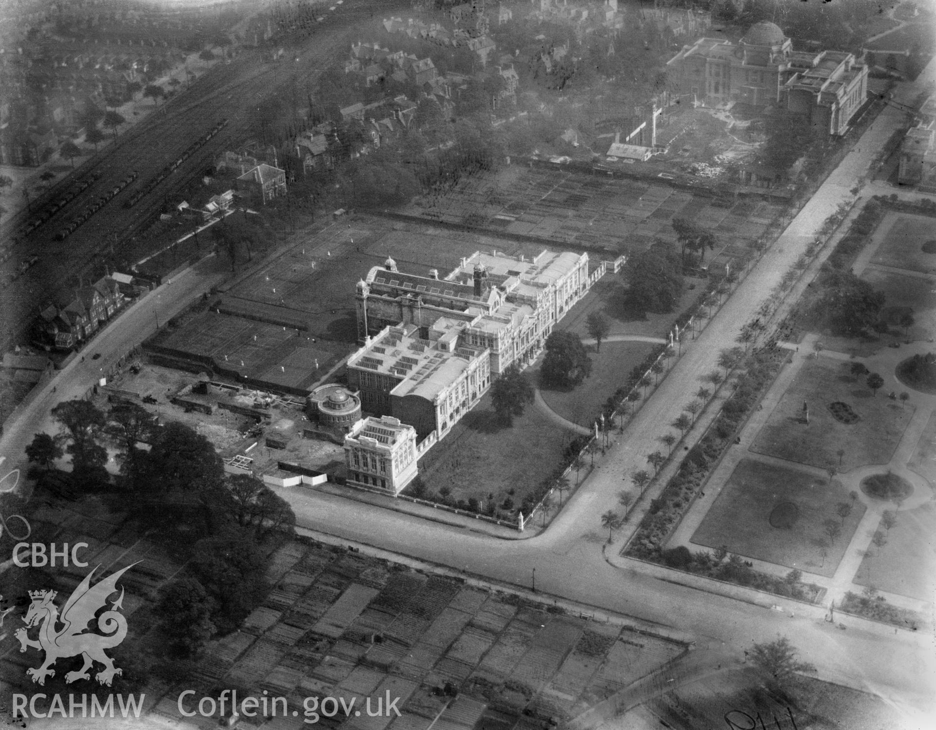 View of Cathays Park, Cardiff, showing University buildings and the National Museum under construction, oblique aerial view. 5?x4? black and white glass plate negative.