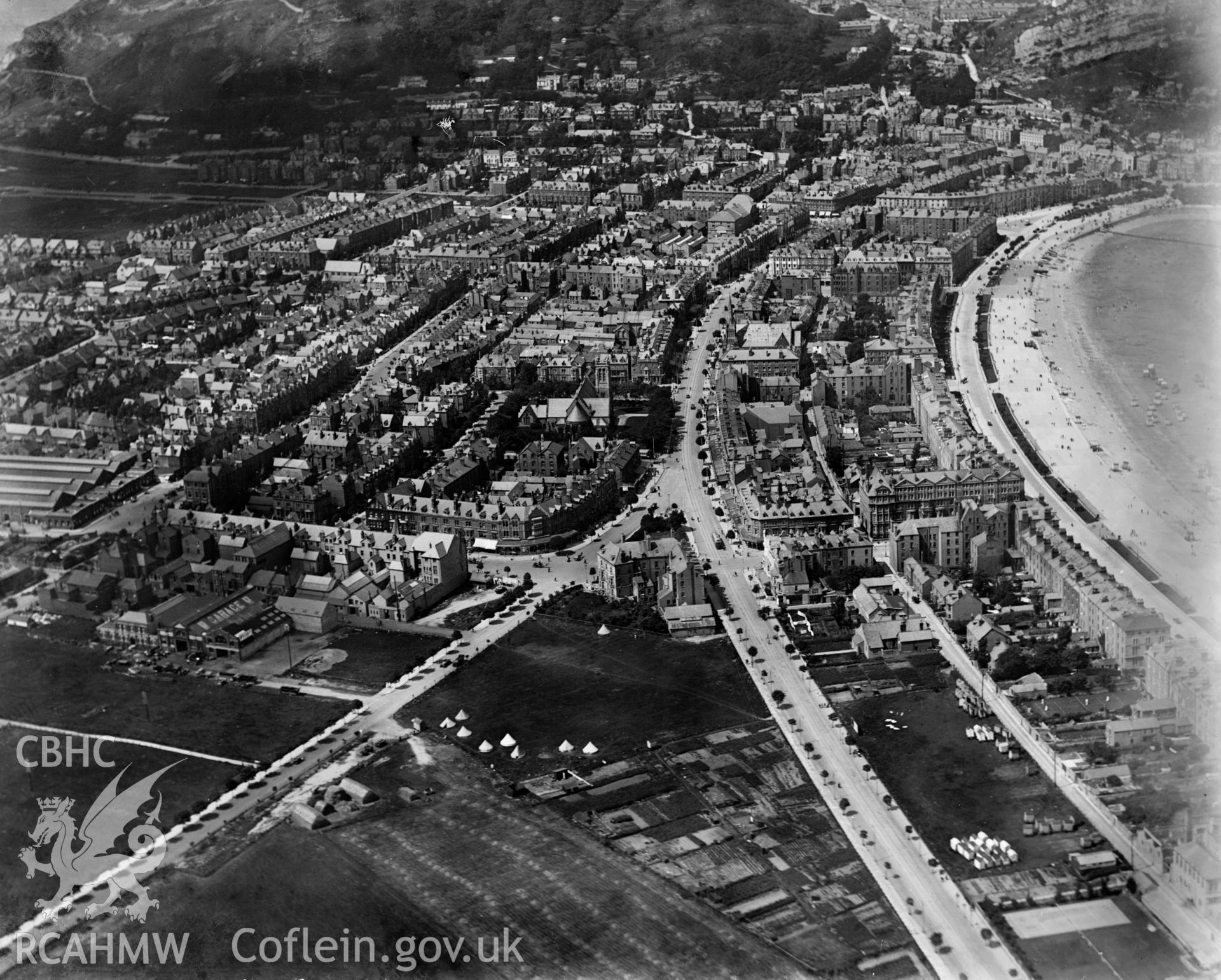 View of Llandudno showing St Tudnos Hotel and tents on playing fields, oblique aerial view. 5?x4? black and white glass plate negative.