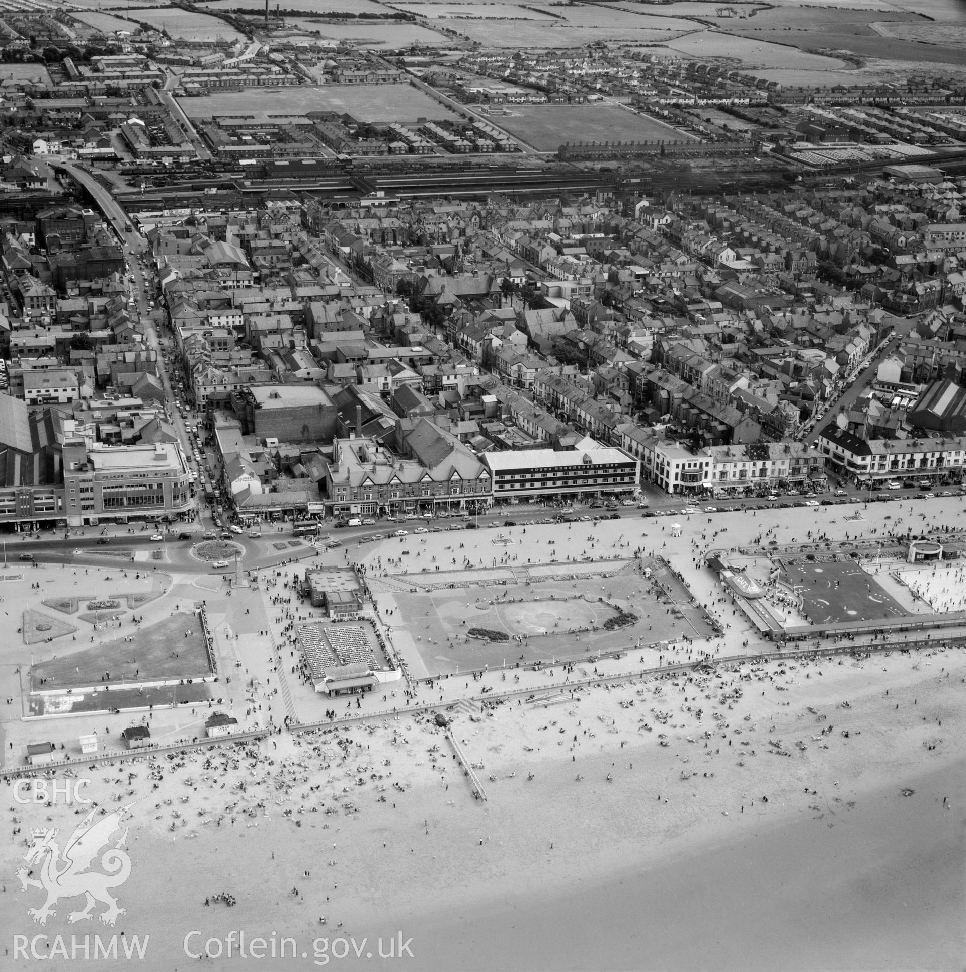 Black and white oblique aerial photograph showing the seafront area of the town of Rhyl  dated 18th July 1961, from Aerofilms album Flints M-Z (W17).