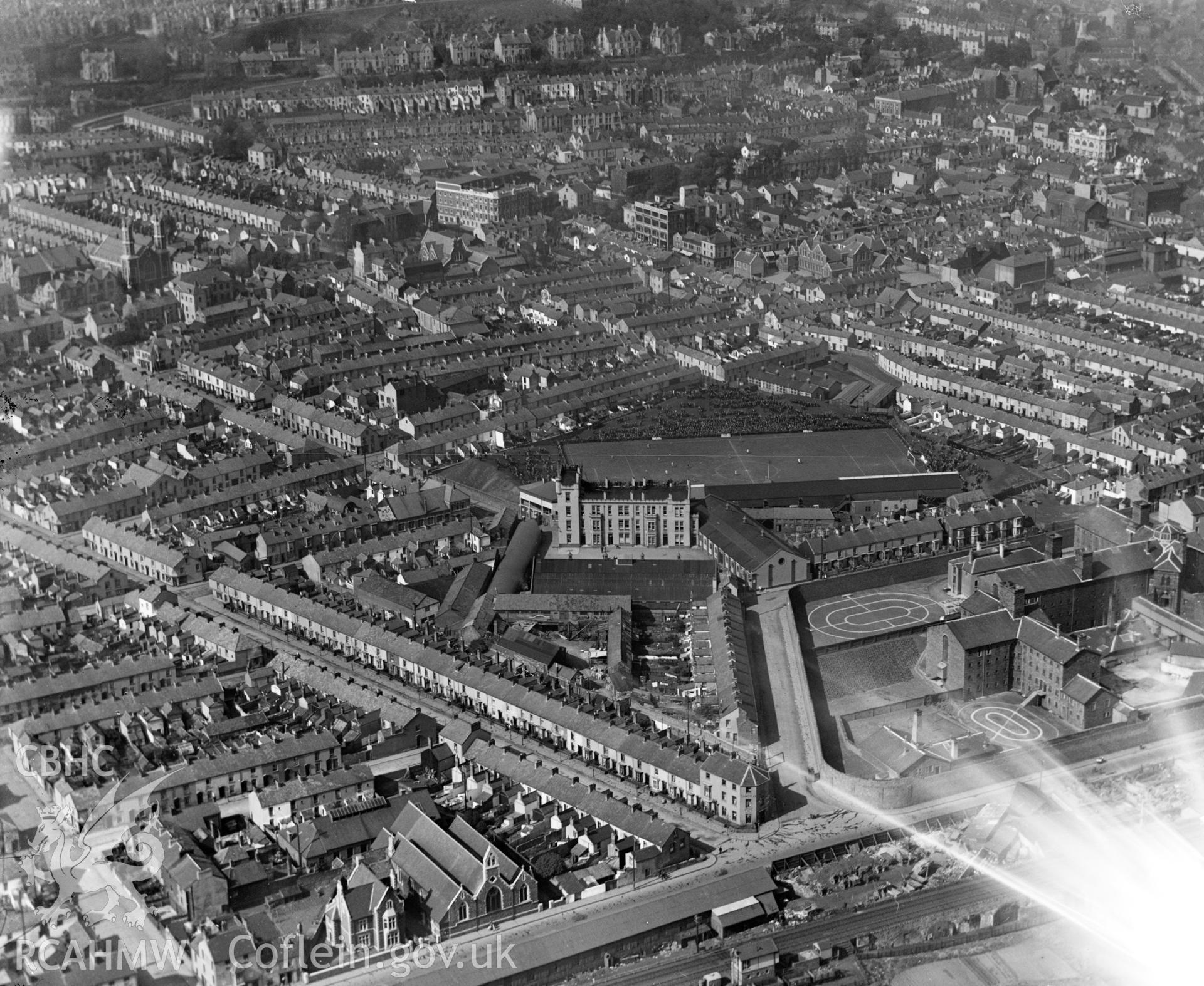View of Swansea showing Vetch football ground with match in progress, and the prison, oblique aerial view. 5?x4? black and white glass plate negative.