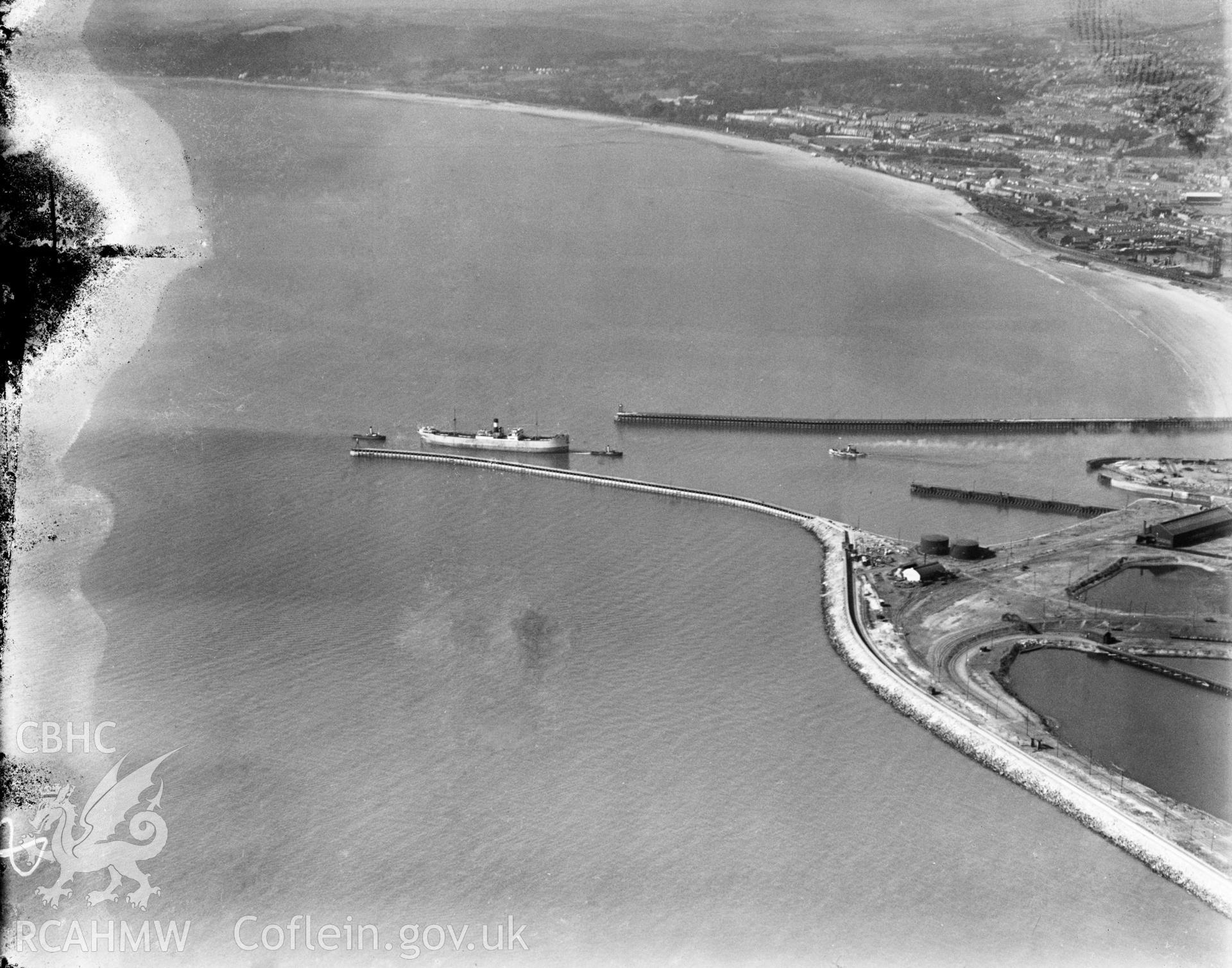 View showing piers and shipping at Swansea docks, oblique aerial view. 5?x4? black and white glass plate negative.