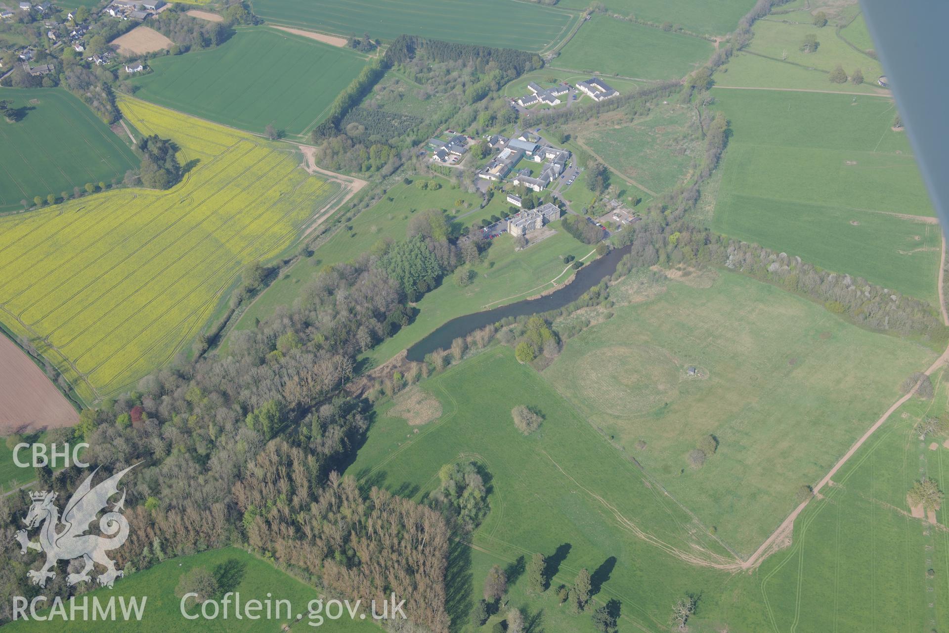 Llanarth Court Garden and Stableblock, and St Mary & St Michael Church and St Teilo's Church. Oblique aerial photograph taken during the Royal Commission's programme of archaeological aerial reconnaissance by Toby Driver on 21st April 2015
