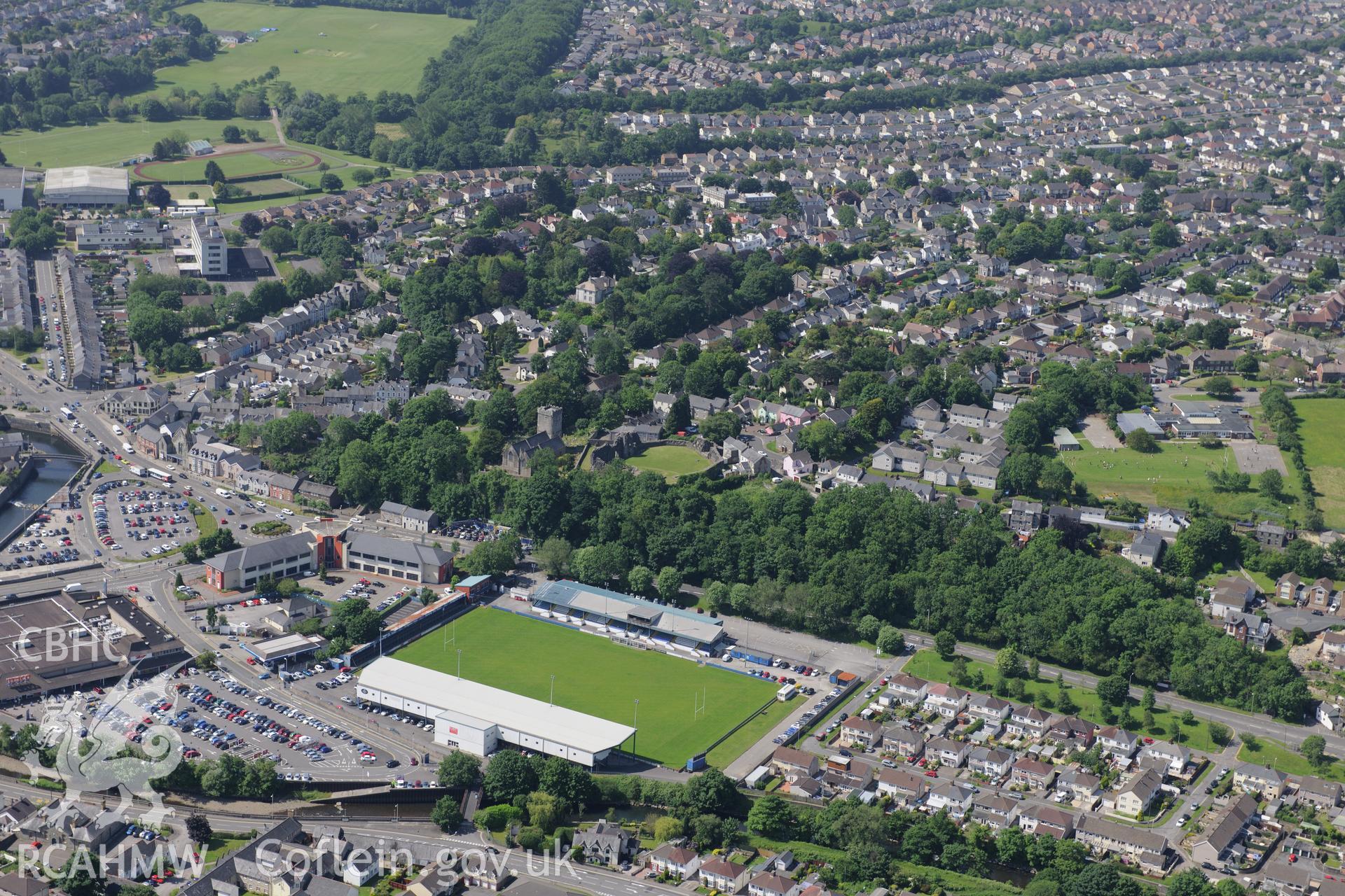 View of Bridgend including St. Illtyd's Church; Newcastle Castle; Brewery Field Stadium and Newbridge Fields. Oblique aerial photograph taken during the Royal Commission?s programme of archaeological aerial reconnaissance by Toby Driver on 19th June 2015.