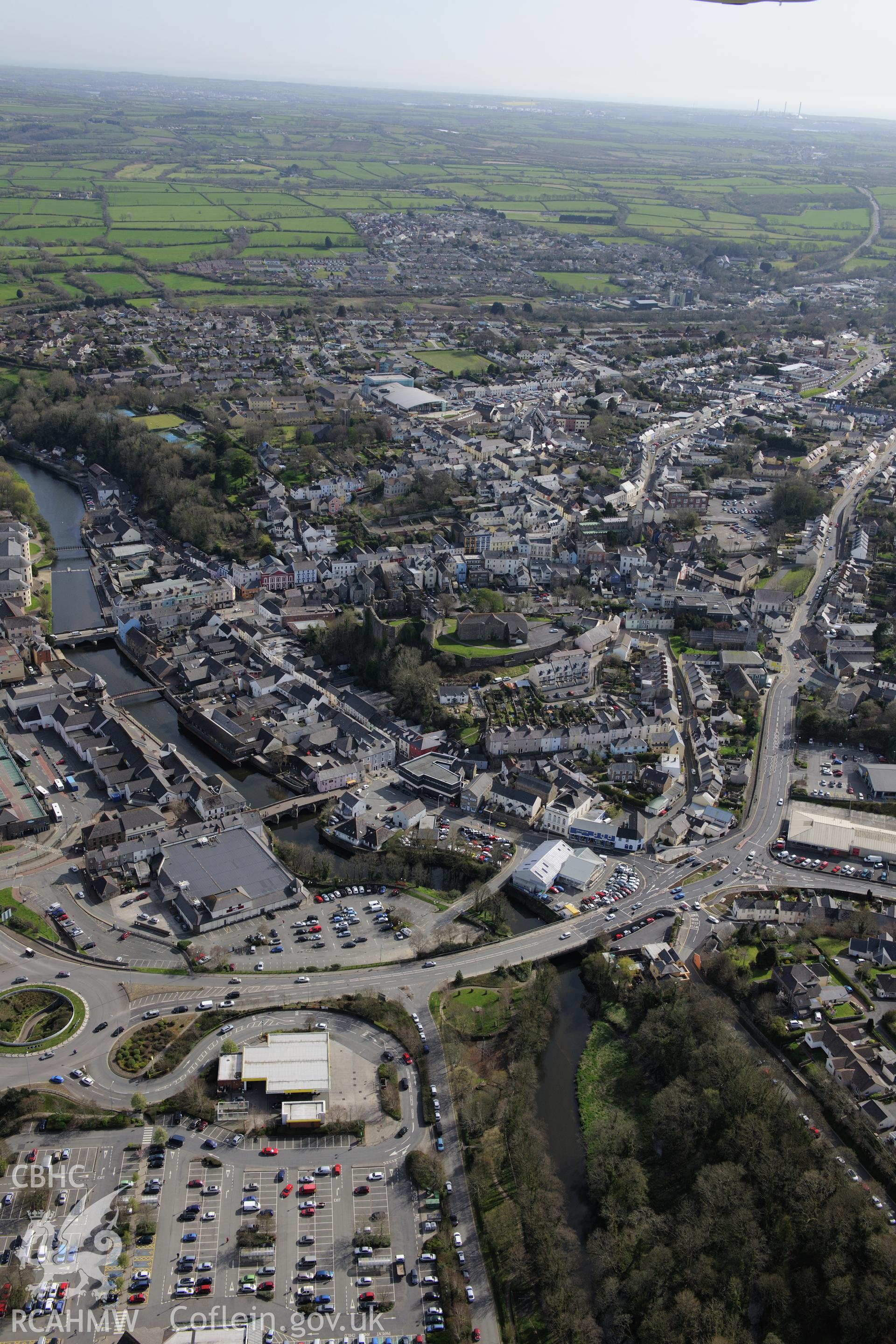 Haverford West, Haverfordwest Castle, (former) Gaol, Old Bridge and New Bridge. Oblique aerial photograph taken during the Royal Commission's programme of archaeological aerial reconnaissance by Toby Driver on 15th April 2015