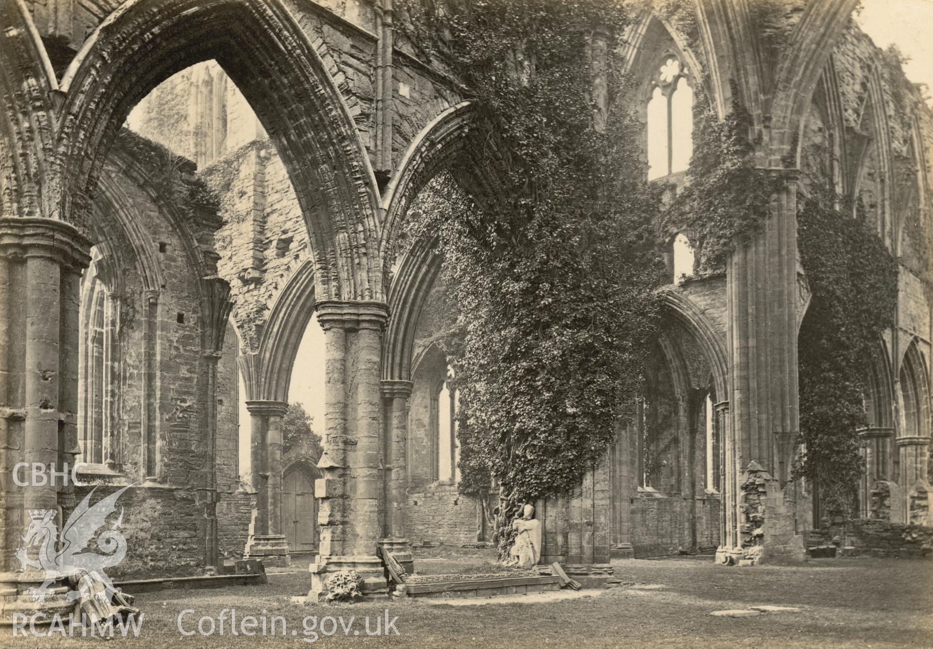 Digital copy of a circa 1870 albumen print showing an interior view of Tintern Abbey looking across the choir.
