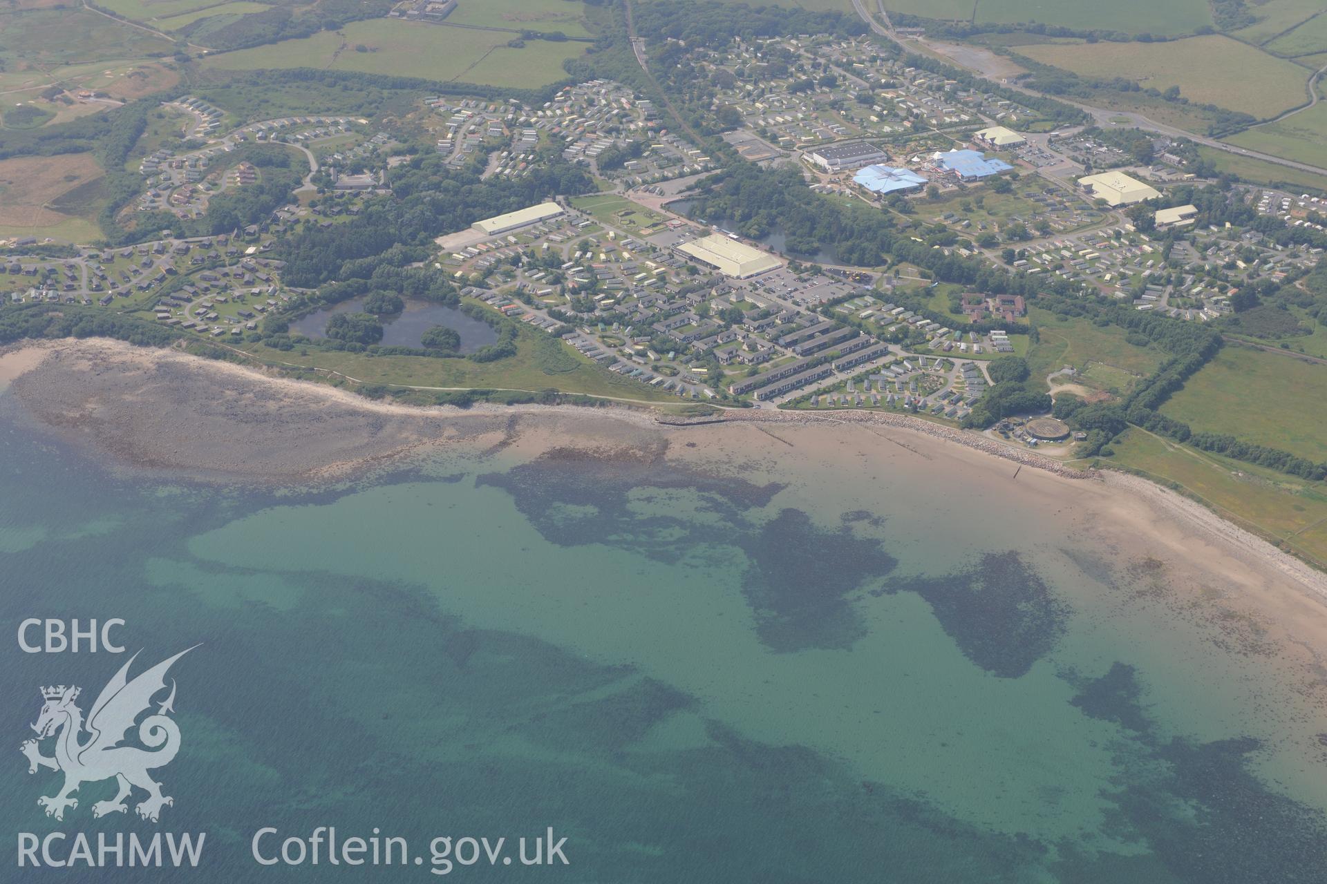 Hafan y Mor Holiday Park and Cerrig y Barcdy Fish Trap, Pwllheli. Oblique aerial photograph taken during the Royal Commission?s programme of archaeological aerial reconnaissance by Toby Driver on 12th July 2013.