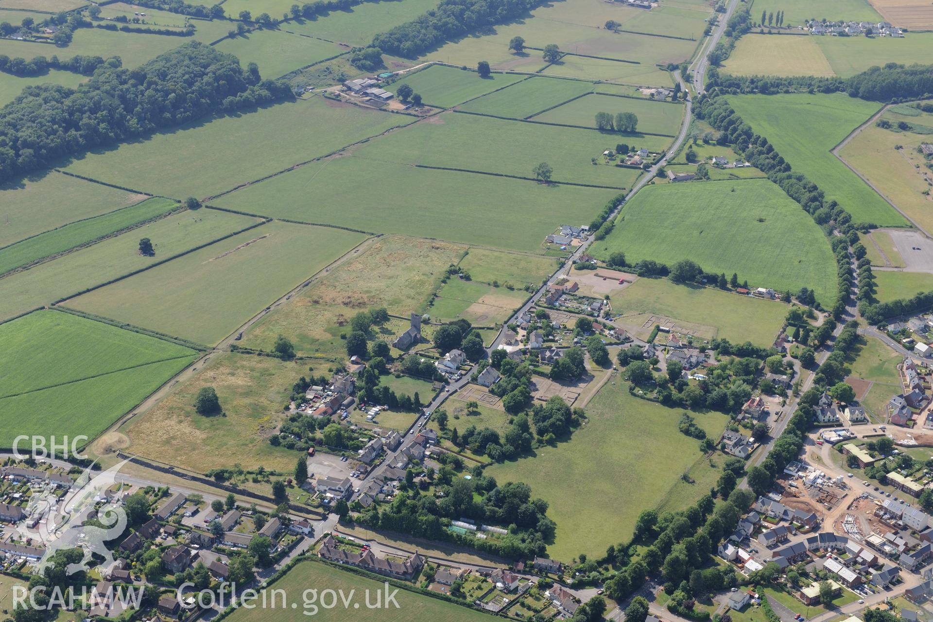 St. Stephen's church, Roman Amphitheatre and Venta Silurum (Caerwent Roman City), Caerwent, near Chepstow. Oblique aerial photograph taken during the Royal Commission?s programme of archaeological aerial reconnaissance by Toby Driver on 1st August 2013.