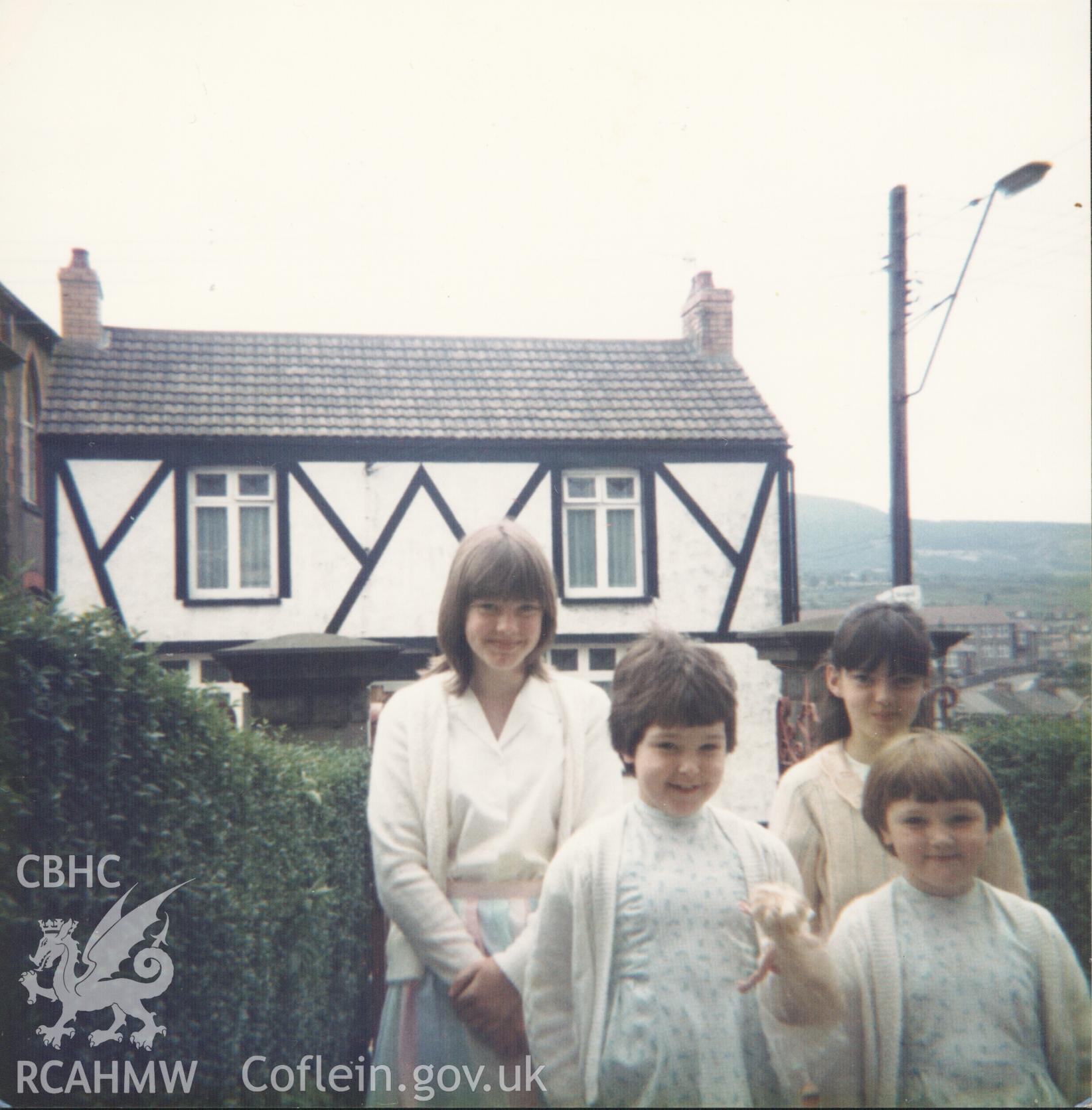 Colour photograph of young members of Bethania chapel congregation on the way to chapel, 26th March 1985. Donated to the RCAHMW by Cyril Philips as part of the Digital Dissent Project.