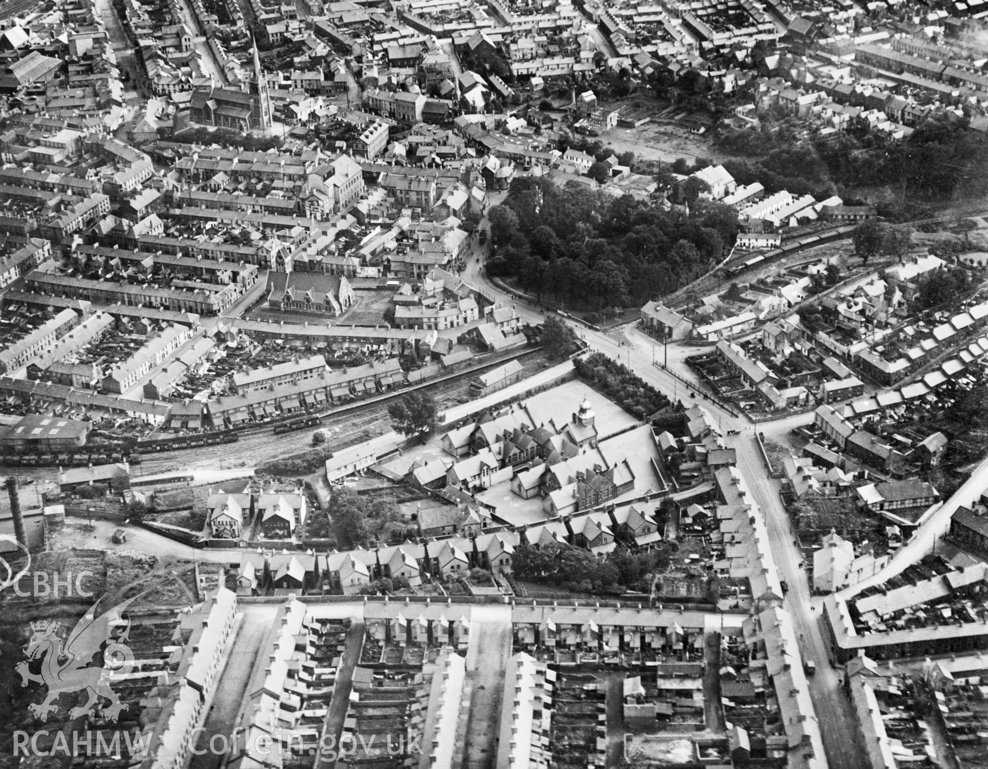 View of part of Aberdare showing St Elvan's church and Gadlys school. Oblique aerial photograph, 5?x4? BW glass plate.