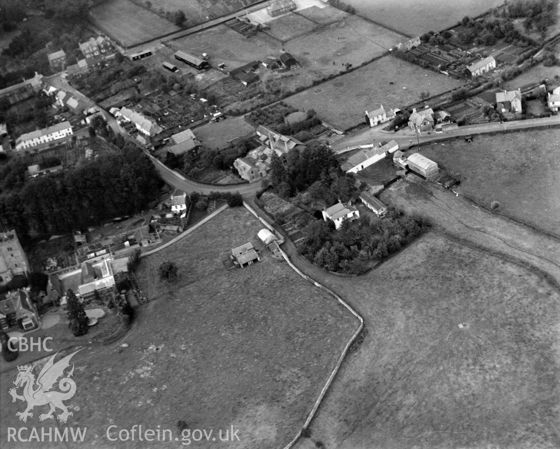 View of the Four Ash Street and Chepstow Road area of Usk showing the Greyhound Inn, Usk Dairy Farm and gasworks. Oblique aerial photograph, 5?x4? BW glass plate.