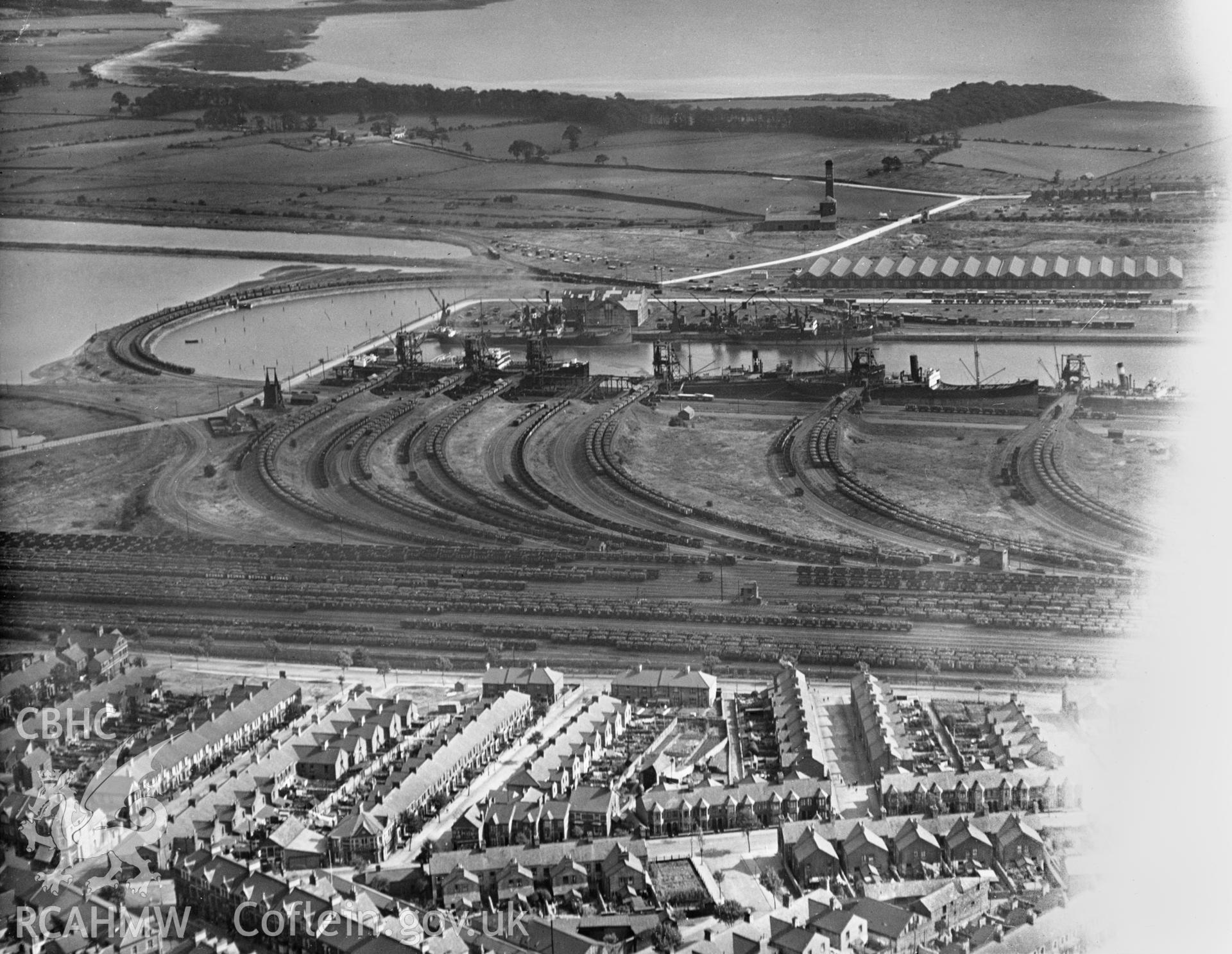 View of Barry showing docks with 'Bedwas' railway trucks. Oblique aerial photograph, 5?x4? BW glass plate.