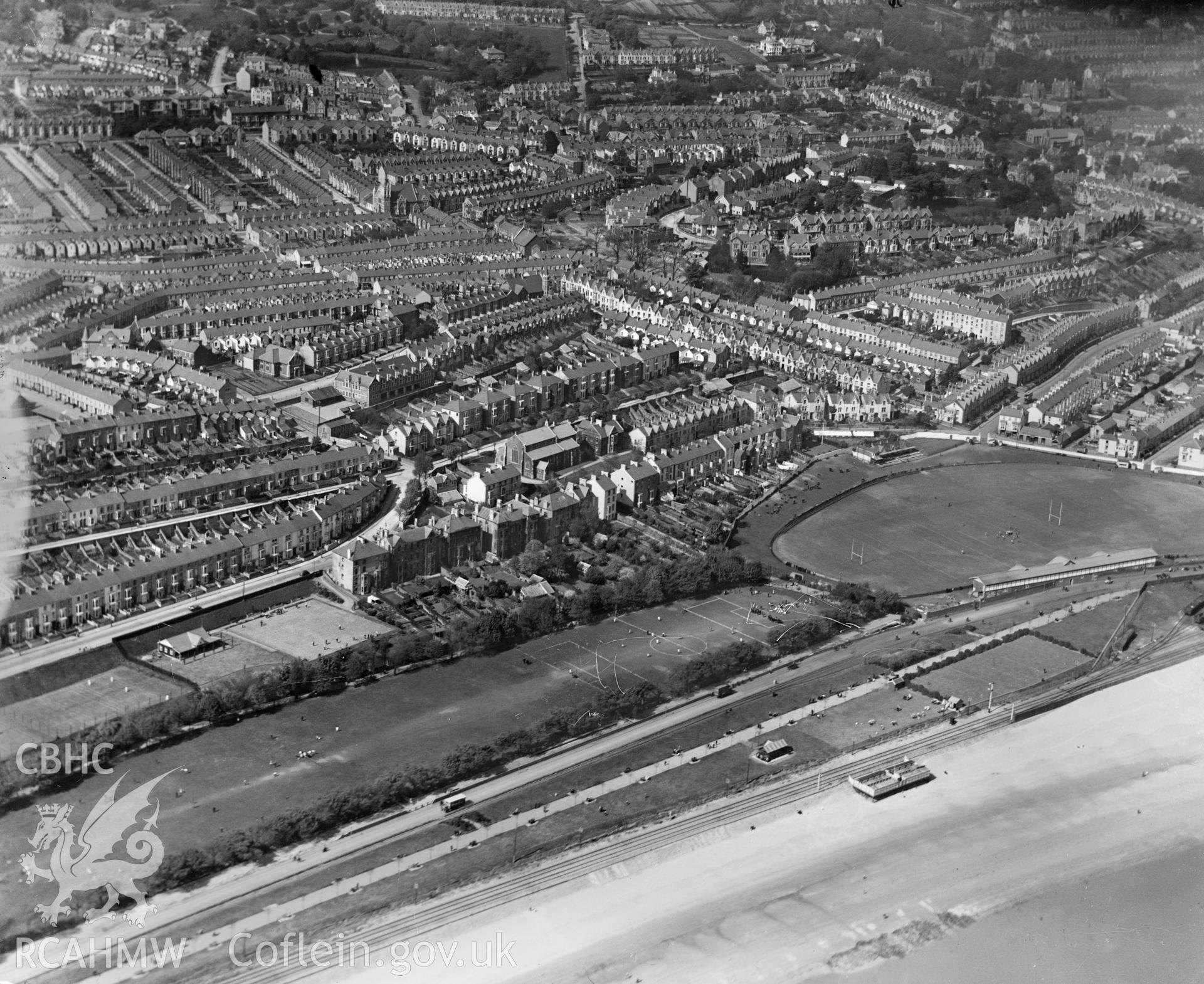 View of Swansea showing St Helen's sports ground with matches in progress, oblique aerial view. 5?x4? black and white glass plate negative.