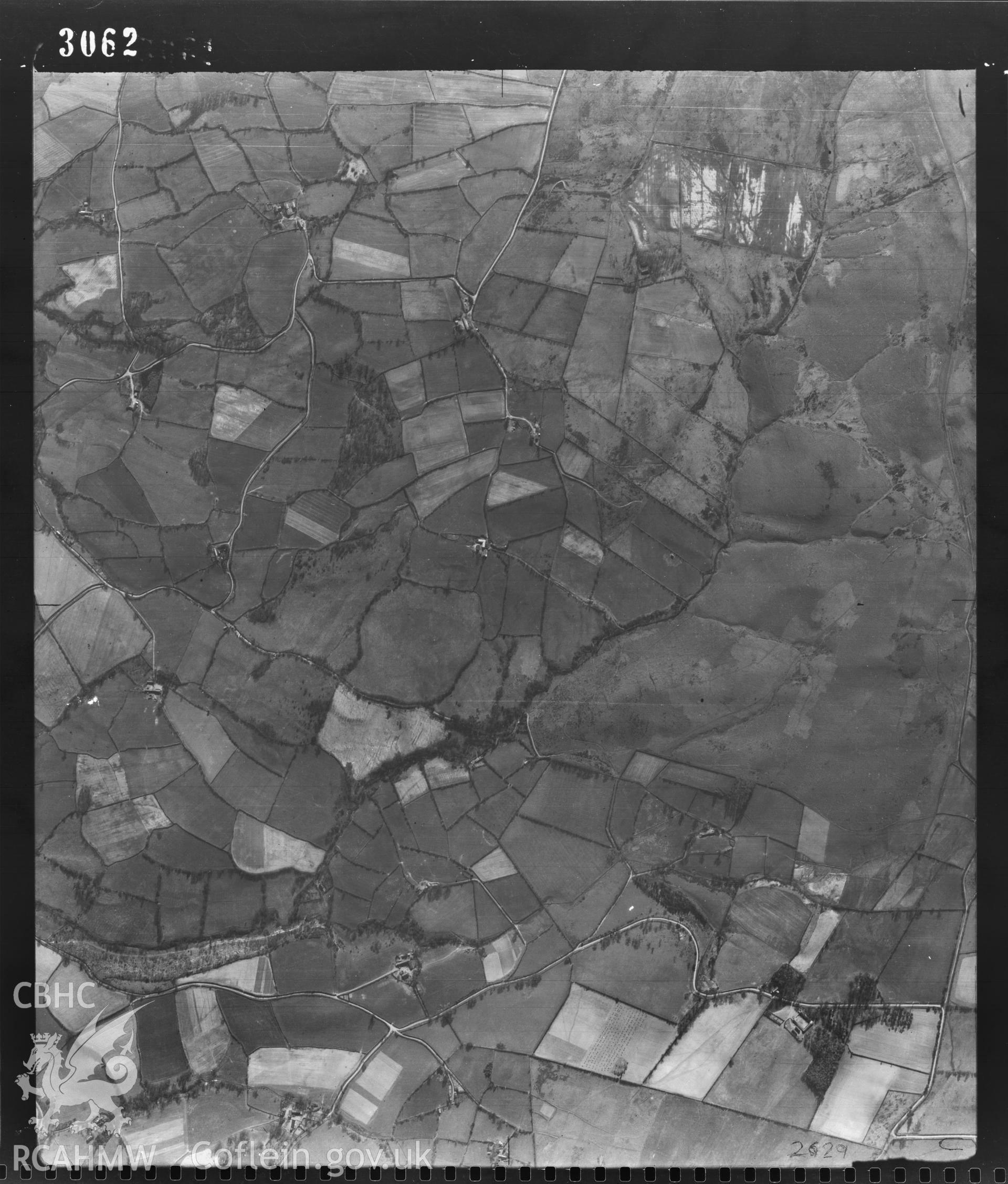 Digital copy of a black and white vertical aerial photograph taken by the RAF on 24/03/1948 centred on SO06008890 at a scale of 1:10000. The photograph includes part of Mochdre community in Powys