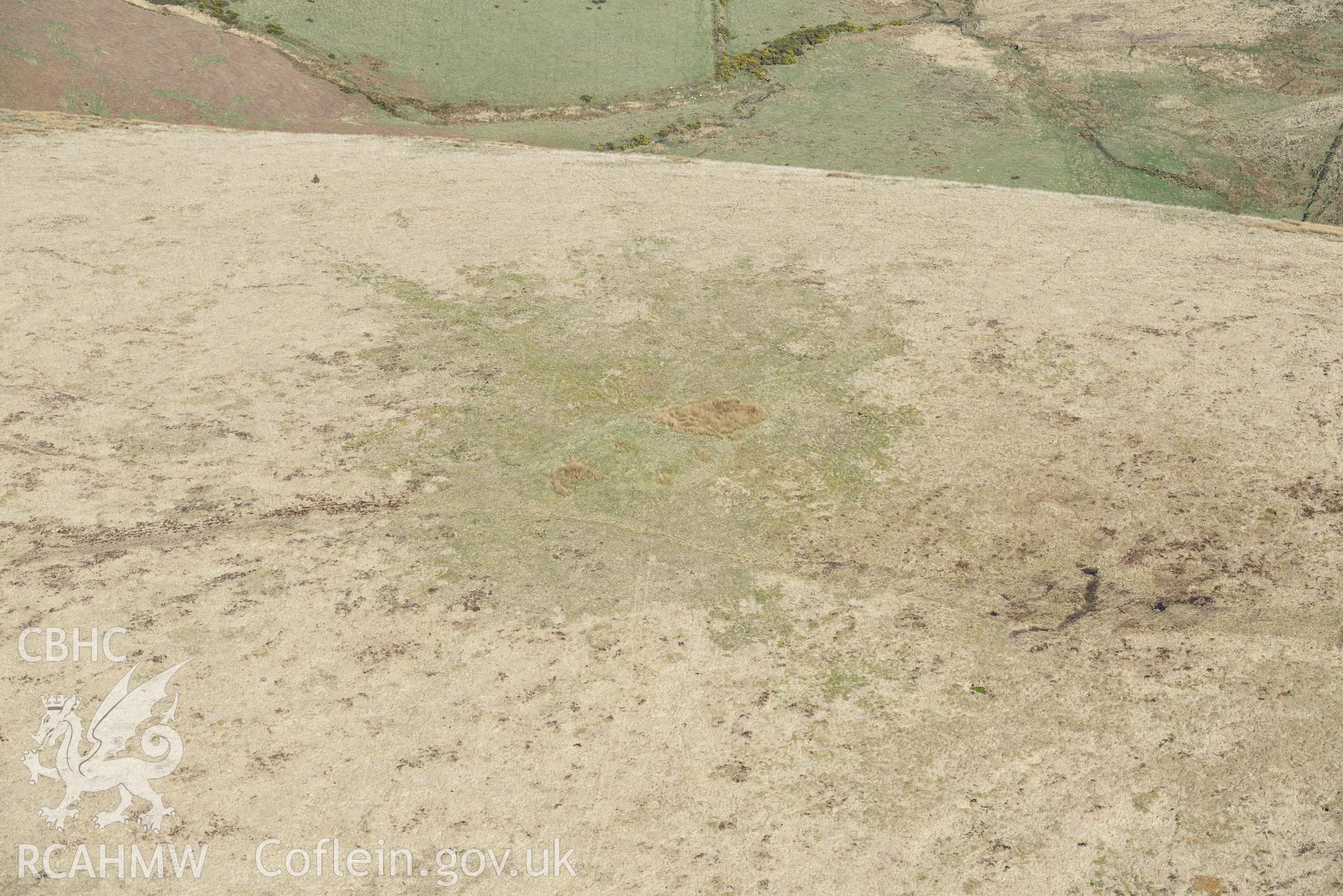 Foel Cwm-Cerwyn, Cairn 1. Oblique aerial photograph taken during the Royal Commission's programme of archaeological aerial reconnaissance by Toby Driver on 15th April 2015.'